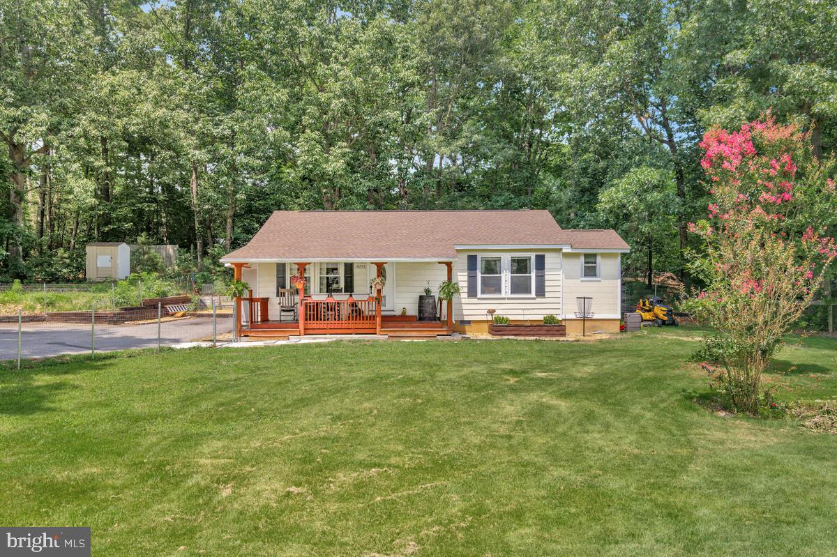 This Adorable 2 Bed, 2 Bath Charmer is Move In Ready!
NO HOA — VA and USDA ELIGIBLE FOR 100% FINANCING!
Welcome home to this beautifully maintained 2-bedroom, 2 full-bath rambler tucked away at the end of a quiet cul-de-sac on a spacious .82-acre lot (tax records do not reflect the correct acreage). Ideally located near NAS Pax River, Webster Field, and St. Mary’s College of Maryland, this charming home blends convenience, comfort, and privacy in one perfect package.
Step inside to discover fresh updates, including a permitted second full bathroom featuring a large walk-in shower, a newer roof, paved driveway, and recently decked attic with a vent fan for added storage and comfort. Enjoy peace of mind with a new water heater, pressure tank, and a whole-house water filtration system. All of these were updated when the Sellers Replaced the Entire Well, in 2021! Even the smoke detectors have been updated to meet modern code!
The kitchen shines with white cabinetry, warm butcher block countertops, and pop-up power towers for modern convenience. Easy-to-clean LVP flooring flows throughout, making this home allergy-friendly and low maintenance.
Outdoor living is a breeze with direct kitchen access to a spacious rear deck and garden, ideal for grilling, entertaining, or relaxing under the stars. The covered front porch is perfect for sipping morning coffee or enjoying peaceful evenings, and the fully fenced yard provides privacy and room to roam. A 13’x13’ storage shed also conveys with the property.
This home is perfect for first-time buyers, downsizers, or anyone looking for affordable living with modern upgrades and room to breathe. Schedule your private showing today! Home Goes LIVE, THURSDAY, JULY 31!