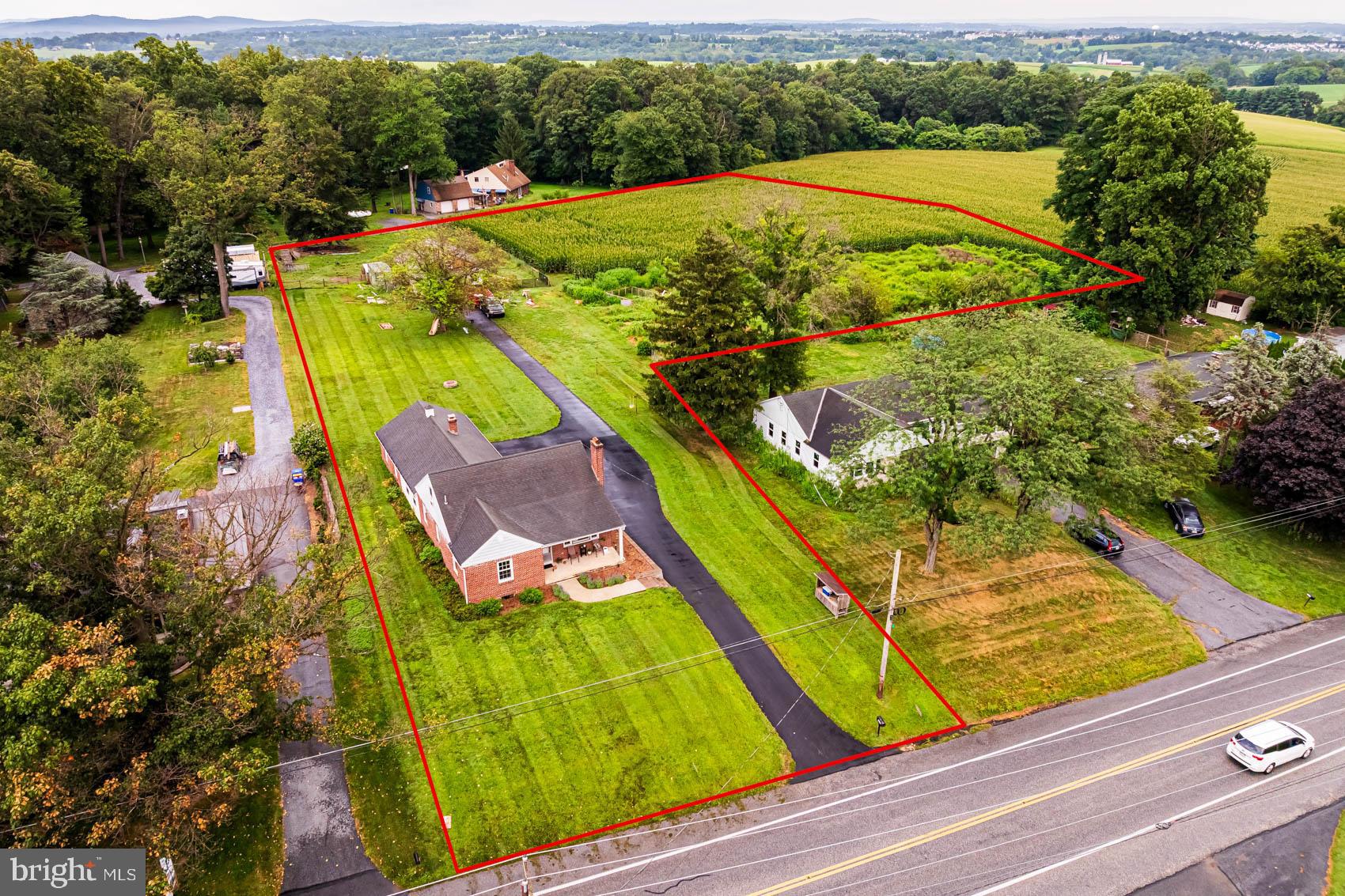 Upcoming Auction October 9th at 5:30 pm . Three bedroom 1 1/2 bath Cape Cod home featuring kitchen, dining room, living room with brick fireplace and hardwood floors, office, basement, front porch, attached two car 20 X 20 garage. Outbuildings: 28 ' x 36' barn/ shop/ garage with 2 overhead doors. Newly remodeled with metal siding & roof. New windows, garage doors & access doors. All this situated on 2.9 acre lot with approximately 2 acre tillable field and fenced pasture . Move in condition house. Small barn with pasture. Borders farmland with farmland views.