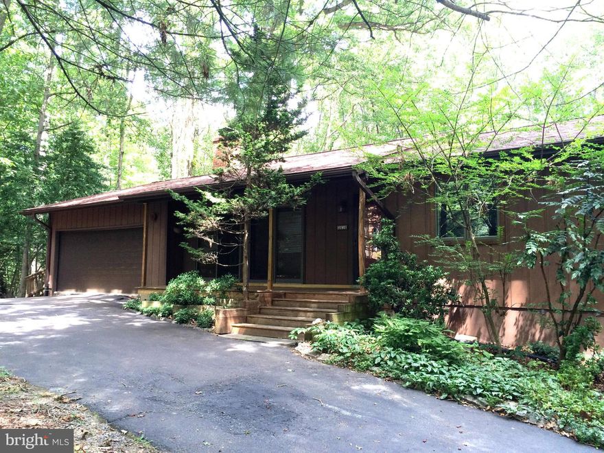 Reduced! Live a vacation!  Rancher on easy-care, retreat-like .8 acres w/private deck & yd.  Adjoins Reston Association parkland. 2,500 SF 5BR & 3 Full Ba offer lots of options! Gleaming hardwood and stone floors on main level.  3BR on main; 2 LL.  Lower Level can be home office or au pair suite  - opens to side patio.Sparkling clean, skylights, whole house fan, woodstove, & more!!
