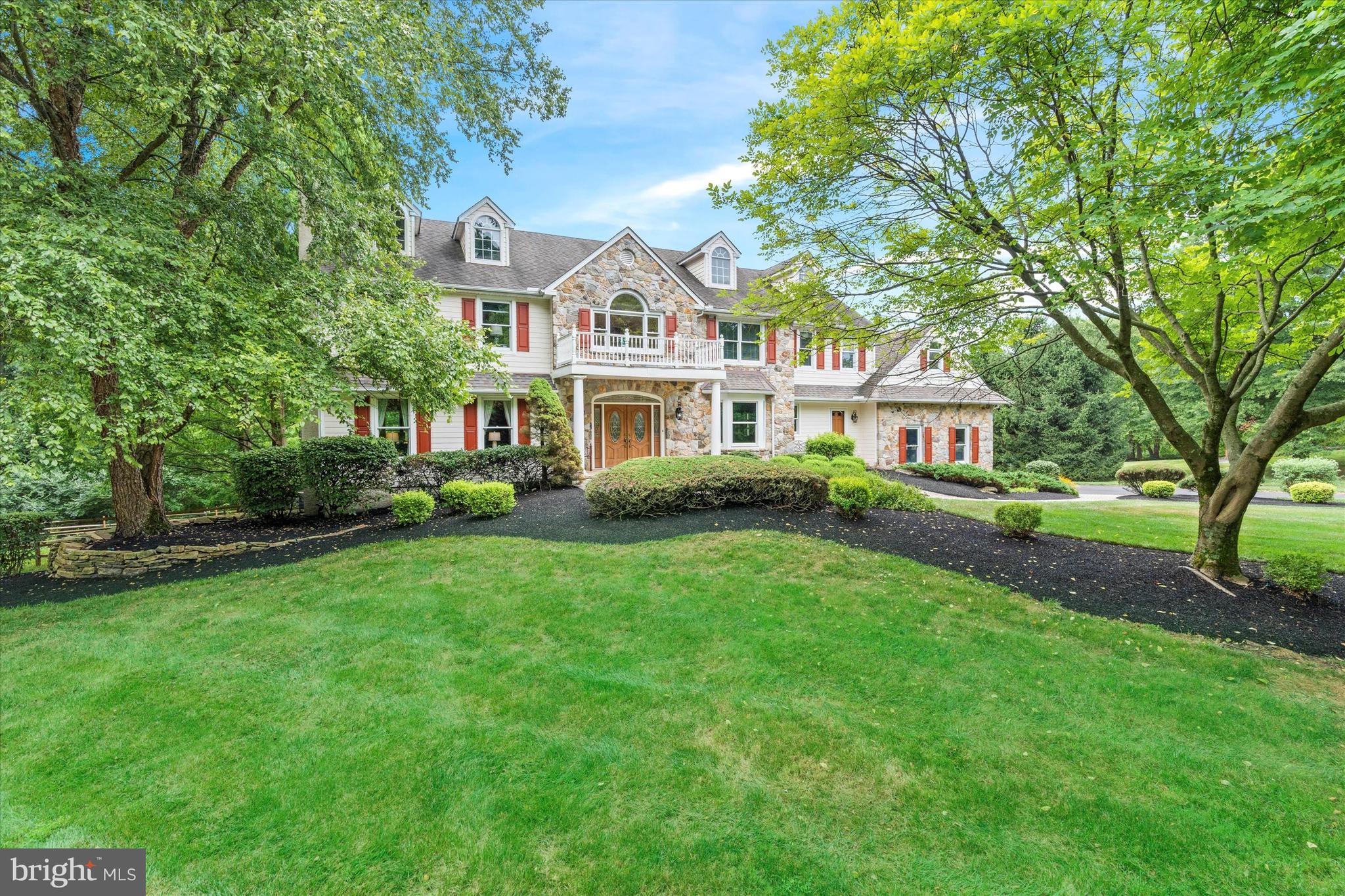 From the moment you approach this exquisite home in Landenberg via the elegant paver walkway and through the double front doors, you'll sense its unique charm. Step into the grand two-story foyer, highlighted by a stunning curved staircase. The foyer is flanked by a formal dining room and a bright, airy living room with a fireplace, four large windows that seamlessly flow into a refined study with 15-light French doors and picturesque exterior views. Continue into the impressive two-story family room, where soaring ceilings and abundant windows create an open, inviting atmosphere. The floor-to-ceiling stone fireplace serves as a striking focal point, offering a warm contrast to the soaring ceilings and expansive views of the gourmet kitchen and breakfast area. The chef’s kitchen features a large island, ample cabinetry, granite countertops, a Viking gas cooktop, wall oven, and microwave. The breakfast nook is perfect for casual gatherings, which opens into a sunroom with vaulted ceilings, numerous windows, and a sliding glass door leading to the deck—ideal for relaxing or reading a book. The kitchen also connects seamlessly to a formal dining room large enough to host grand celebrations. A 2nd powder room on the first floor and a spacious laundry room with exterior access & a rear staircase add to the home’s functionality. Walking up the main staircase, you will enter the grand upstairs hallway, which features a spacious design with large built-in bookshelves beneath a striking Palladian window that illuminates the second-floor foyer. You'll enjoy the luxurious primary suite which offers double doors, four windows, a gas log fireplace, and two walk-in closets. The beautifully remodeled primary bath features a large shower, freestanding tub, double vanity with tower, and abundant tile and windows, creating a spa-like retreat. The princess suite is generously sized with its own bath and closet. Across the hall, another spacious bedroom with two windows and a double closet awaits. A fourth bedroom mirrors the same features. Down the hall, you'll find the hall bath and a large hall closet which provides additional storage space. Finally, discover the fifth bedroom, a versatile bonus room running from the front to the back of the house over the three-car garage. This expansive space, characterized by unique angles, built-in bookcases, and a huge walk-in closet, offers endless possibilities as a fifth bedroom or any other type of room you envision. Exiting the fifth bedroom, you can head down to the main level via the second staircase. Then take the basement stairs to the LL where you'll be amazed by its exceptional finish. This daylight basement boasts a spacious media and family room area with a wet bar, plus there is a full kitchen complete with a refrigerator, dishwasher, sink, and microwave. Large windows and a sliding glass door offer views and access to the beautiful paver patio and pool area. The lower level also features a full bath with a standing shower, a workout room with a sauna, and ample storage options. The media room is equipped with surround sound, one of three surround sound systems throughout the home, including the master bedroom and family room. Additionally, there’s a large unfinished storage space with double doors that opens to the patio. Outside, this magnificent home offers a heated pool surrounded by a beautifully landscaped paver patio area. A stunning stone waterfall enhances the serene setting, which backs to woods and the White Clay Creek Preserve. Enjoy breathtaking views from the 63-foot deck, and appreciate the extensive landscaping, including retaining walls and walkways, all contributing to this exceptional home. This home is a true blend of elegance and functionality, perfect for both grand entertaining & everyday living. This extraordinary home, nestled in the rolling hills of Landenberg, is ready to welcome its next family to create lasting memories and enjoy countless moments of joy!