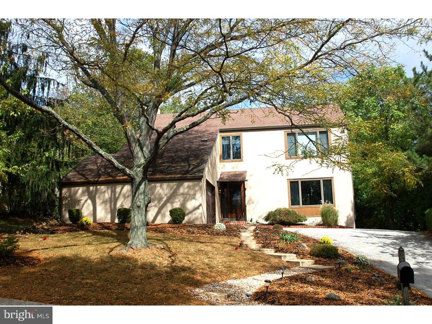 Back on the Market with a new Master bath and recently staged for a new look! Don't miss this bright and charming contemporary home in popular Ithan Mills with every amenity.  Updated throughout with hardwood floors on 1st & 2nd floors, new kitchen and updated baths, as well as a finished basement, it is just what you've been waiting for!  As you enter the foyer you are drawn to the elegant living room with a triple window, which opens to a formal dining room that looks out to backyard and open space.  The Gourmet Eat-in kitchen is complete with granite countertops, stainless appliances, under counter convection microwave, stainless tile backsplash, cherry cabinets, plenty of pantry storage and opens to a warm family room with brick fireplace, built-ins and sliders to rear deck.  A new powder room, laundry/mudroom and access to garage complete the first floor.  The 2nd floor has a generous Master bedroom with walk-in closet, French doors to Master bath with private deck, tiled glass enclosed shower and double pedestal sinks, along with 3 additional bedrooms and a hall bath.  All closets have been updated with California style closets. The lower level has large game room and separate unfinished storage area.  Don't miss this great value in a wonderful neighborhood!