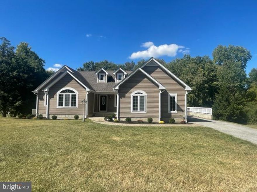 Spectacular open floor plan contemporary with stunning views of an almost acre lot with views of a the pond.  This is truly a ONE of a kind home just outside of Waldorf. Gourmet kitchen is like new. Granite countertops with seating at the breakfast bar.  Wide plank hardwood throughout most of both levels, 3 custom bathrooms. Huge deck great for gatherings or those afternoon cookouts. The basement boast an extra large built in bar thats perfect for entertaining, separate game area, tv area, a 4th bedroom and the third bath. Side car entry two car garage and ample driveway parking as well.  This one is what your picky buyers are looking for. Shows like a new home!!!!