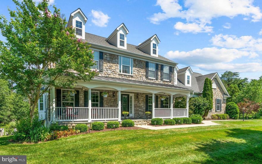 Every element of this 7000 square foot home has been designed for comfort, style, and function - from the gourmet kitchen and luxurious owner’s suite to the resort-inspired backyard with a saltwater pool, spa, and multiple outdoor living spaces. Step inside to a bright foyer with travertine tile floors and an elegant curved staircase. High ceilings, abundant natural light, and thoughtful craftsmanship define the main level. The living and dining rooms provide elegant spaces for entertaining, while the private office with bay windows offers serene back-yard views. At the heart of the home, the platinum-level gourmet kitchen features stainless-steel appliances - refrigerator (2025), gas cooktop (2022), double wall ovens (2020), and dishwasher (2019) - plus granite countertops, a large island, and ample cabinetry. Two butler’s pantries - one with a mini fridge and another with a sink - connect seamlessly to the sunroom and formal dining room, ideal for gatherings. The sunroom opens to a screened Trex deck, perfect for morning coffee or evening relaxation. The family room offers a cozy, open space anchored by the fireplace. Completing the main level are a half bath and an upgraded mudroom with custom cabinetry, granite counters, and a utility sink. Upstairs, the home offers four bedrooms and three full baths. Watch the sunrise each morning from the lovely primary suite which includes a tray ceiling, HUGE custom Elfa walk-in closets, a cozy fireplace, and a spa-inspired bath with a soaking tub and oversized shower. Two bedrooms share a Jack-and-Jill bath, and a fourth has its own private bath - ideal for family or guests. Every room feels bright, spacious, and thoughtfully finished. The fully finished lower level adds versatility and comfort with a fifth bedroom, full bath, and media/fitness room. A custom bar - complete with sink, dishwasher, ice maker, and mini fridge - creates a perfect entertainment area. Recessed lighting throughout enhances the warm, welcoming feel. Outdoors, this home transforms into a private retreat. The heated saltwater pool features a diving board, sport attachments, and an automatic cover. A 10-person hot tub sits nearby for year-round relaxation. The screened-in deck overlooks the pool and lush landscaping, while a covered patio, flagstone grilling area, and gazebo with wood-burning fireplace complete the perfect entertaining space. A fully fenced yard, shed, and extended driveway add convenience and function. Additional highlights include a three-car garage with automatic openers, abundant interior storage, multiple pantries, and customized closets throughout plus three additional parking spot in the driveway. Located in Evergreen Hamlet, this home offers a rare combination of luxury and location. The Evergreen Hamlet HOA covers trash service, snow removal, and common area maintenance. The community is ideally located for both recreation and commuting. You’ll love being close to everything that makes Loudoun County living special:

    •    Brambleton Town Center – 1 mile
    •    Hanson Regional Park – 0.3 mile
    •    Beaverdam Reservoir – 3.4 miles
    •    Dulles Landing Plaza – 4.7 miles
    •    One Loudoun – 6.9 miles
    •    Silver Line Metro – 5.6 miles
    •    Dulles Airport – 7.3 miles

For those commuting by car, there’s easy access to Routes 50, 28, and 7, as well as Toll Route 267 (Dulles Greenway) - placing Reston, Tysons Corner, and Washington, D.C within easy reach.
