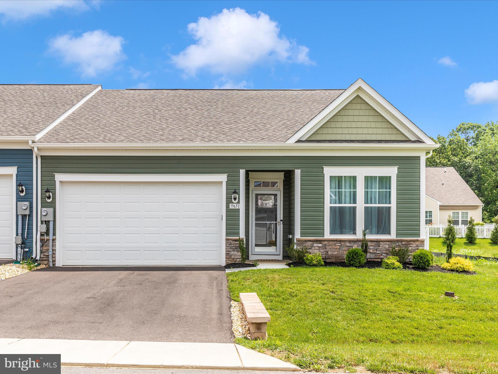 Huge price drop!! Move-in ready - No wait!
This beautiful, like-new unit was built just nearly a year ago, and what sets it apart from the surrounding newly built homes; it boasts *ADDED AMENITIES* that the OTHER NEW UNITS DO NOT HAVE and saves you time and expense. *BRING YOUR PETS!* *IT’S MOVE IN READY* with everything in place, featuring:
- A *fenced back yard*
- *Ceiling fans with lights*
- A *storm door*
- Beautiful *rise and fall lights* over the 8' kitchen island
- *GE Smart Energy Saver washer & dryer* with storage drawers
- *Storage shelves in the garage*
- A *Ring security door camera*
- *PATIO DRAINAGE IMPROVED* saving you the hassle: condensation from the air conditioner is now redirected AWAY FROM THE PATIO, eliminating winter ice hazards and allowing comfortable summer use.
Come see for yourself! This spacious home welcomes you with:
- 2 bedrooms
- An *office/craft room*
- A *sunroom*
- *Cathedral ceilings* and a wall of windows in the living room, dining room, and kitchen create a large, airy and sunny space
- A sunroom AND patio for outdoor enjoyment
- *Quartz countertops*, stainless steel appliances, and a designer ceiling fan in the living room
- An 8' island with plenty of room for family gatherings in the beautiful kitchen
- A primary suite with *two walk-in closets* and an ensuite
- A full bath conveniently located outside the 2nd bedroom for guests
Enjoy!
Come and see for yourself!