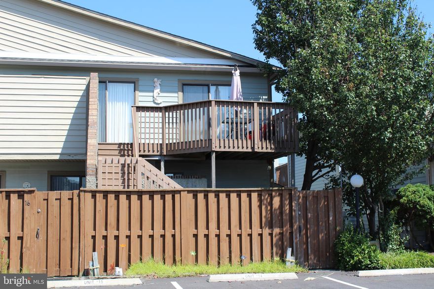 This is your private beach getaway. Comfortable 2 bedroom 2 full bath condo, hardwood flooring in living room  & kitchen, carpet in the bedrooms. New vanities in both baths, one with an over-sized tile shower.  Ample closet space, all with mirrored doors. Ceiling fans,  HVAC installed 4 years, new electrical panel, roof is 3 years old and a newer water heater. Trek exterior on balcony and steps.  Balcony can be accessed by both a sliding door from the living room and the bedroom.  The length of balcony is the full width of the condo. The entrance to this condo is through a lower level unique courtyard,  spacious and  great for entertaining and private.  Rarely does one of these condos come on the market, so do not miss out on this one!    1 year home warranty included for buyer.