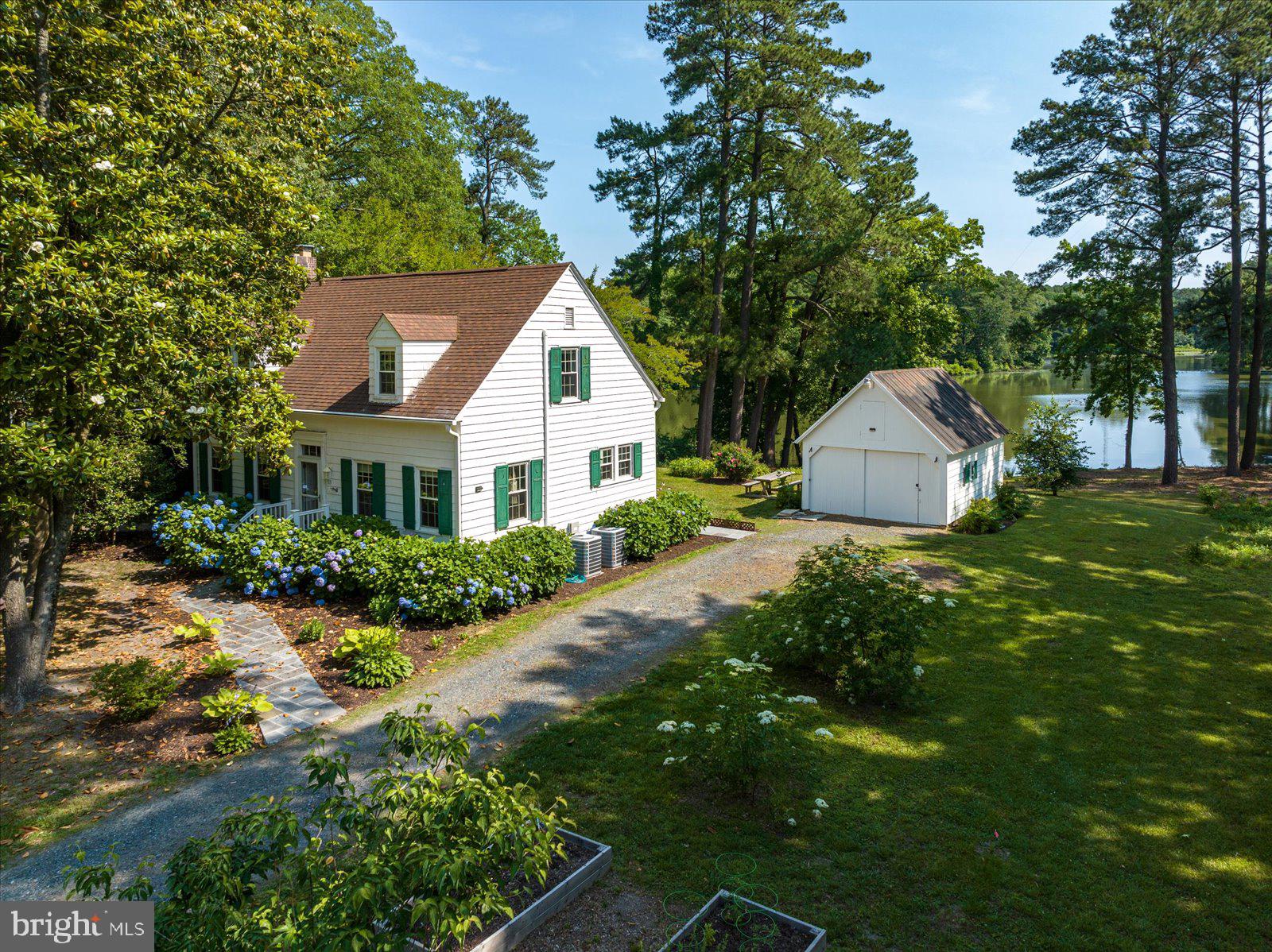 **Back on the market due to no fault of the seller!** What a special property! This charming waterfront 3 Bedroom, 1.5 bath Cape Cod boasts a lovely view of Johnson's Pond. The large side lot is actually another waterfront buildable lot! The huge screened porch is a perfect place to relax and enjoy the serene view. The traditional floor plan includes a dining room off the updated kitchen, and a nice sized living room with both a fireplace and a pellet stove, and an additional room off the living room that could be a perfect office, library, or art studio. The basement and detached one car garage provide plenty of storage, and the long driveway allows for lots of off street parking. A little slice of nature in the city. Don't wait, schedule a showing today!