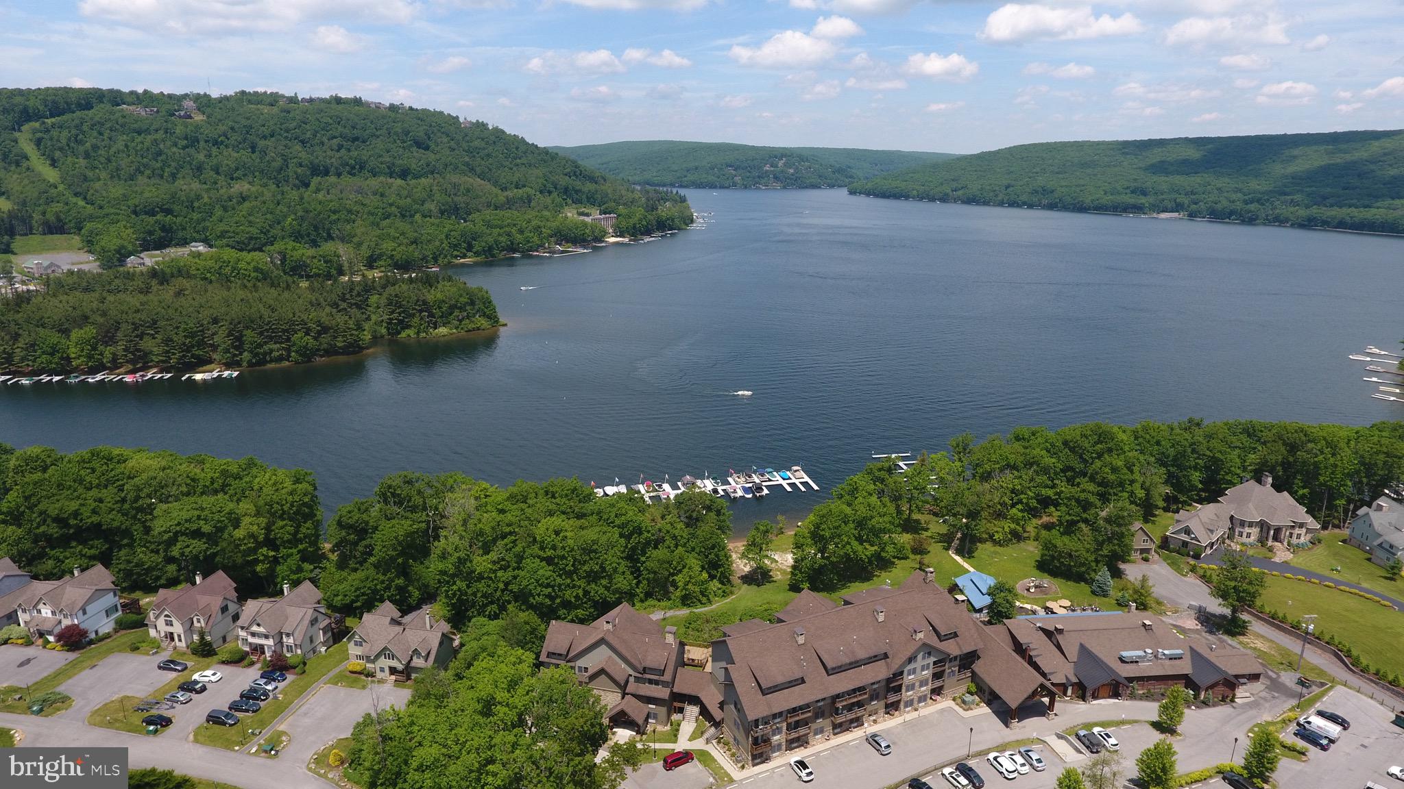 Silver Tree Suites offers 350' of pristine shoreline at Deep Creek Lake with western exposure centrally located to all area amenities. Unit 212A offers a one level floorpan with private bedroom on the second floor of building A which offers easy access to the lobby, elevator, gym, sauna, game room and patio area overlooking the lake. Condominium ownership at Silver Tree Suites offers ease of maintenance as the association takes care of all of the grounds and building maintenance. This unit is an established vacation rental ready for you to take ownership this summer! Call today to schedule a private showing!