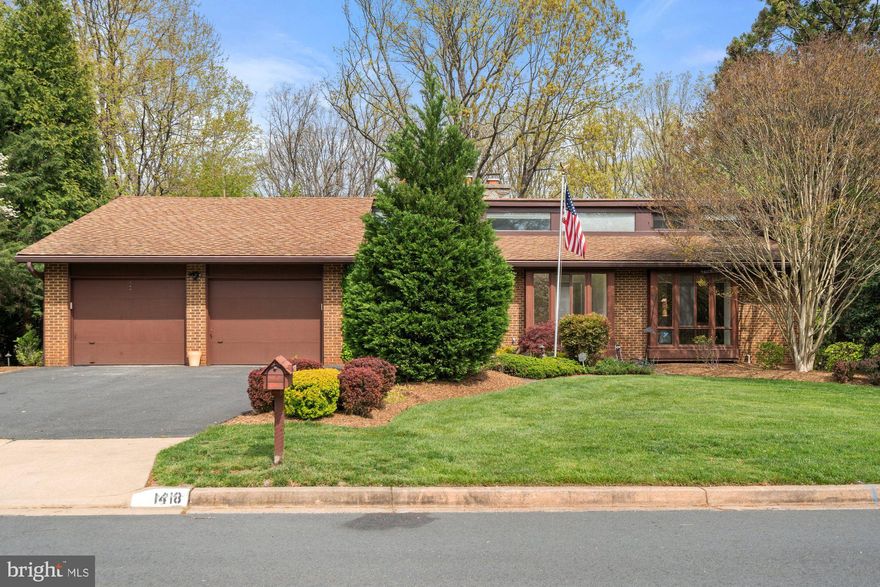 Charming home in the Wolf Trap Woods community, on a private 0.36-acre lot! This home offers 5 bedrooms, 3.5 baths, and 3,334 finished square feet across two spacious levels. This home features thoughtful details throughout with clerestory windows, custom built-ins, and recessed lighting. An entryway pond with waterfall and beautiful double doors welcome you inside to a cathedral ceiling foyer, living room, and formal dining room. The living room features an impressive wood burning stone fireplace. Spacious kitchen with plenty of cabinetry flows seamlessly into the breakfast room. The breakfast room includes large bay windows, skylight, and screen door leading outside to a perfect outdoor dining area. The owner’s suite includes private dressing room, walk-in closet, ensuite bathroom, vaulted ceilings, and attached sitting room with spiral staircase leading downstairs. The main level also features additional bedroom and office with custom built-ins, full bath, entryway half-bath and laundry room. Walk-out lower level is perfect for entertaining or relaxing, with large recreation room featuring another beautiful stone wood-burning fireplace, billiard’s room withn pool table, and another two bedroom and full bathroom that’s perfect for guests. The lower level also features a large storage and workshop area that is perfect for all your hobbies! Enjoy outdoor living on the back deck, patio under deck providing shade, well maintained backyard, and mature trees great for privacy. Two car-garage with driveway parking space suited for multiple cars. All of this in a prime Vienna location, close to the Wolf Trap National Park for the Performing Arts Amphitheater, local parks, downtown shops, restaurants, and the Metro. Colvin/Cooper/Langely Pyramid.