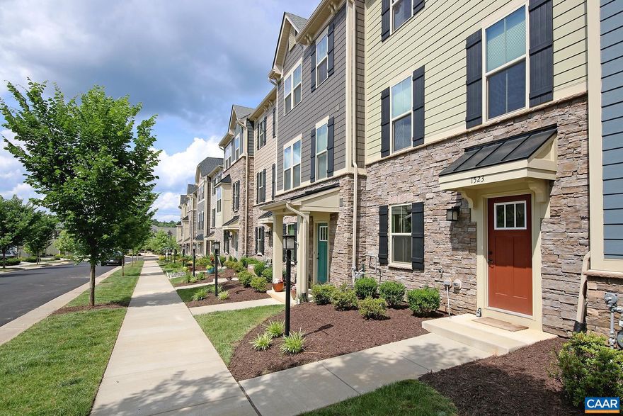 Move-in Ready! This 3 bedroom, 2 full/2 half bath Cascadia townhome is convenient to the 250 bypass and I-64, shops and restaurants, Darden Towe Park, and Sentara Martha Jefferson Hospital. Downtown and UVA Medical Center are less than 4 miles away, and the neighborhood features multiple playgrounds, a clubhouse, and a pool.  The 1,850 sqft townhome features a light-filled interior, LVP flooring throughout the ground and main living level, high ceilings and recessed lighting, a full-size washer and dryer on the bedroom level, a rear deck, and a fenced-in backyard with stepping stones to a detached rear entry 2 car garage.   The main level offers an open living room, a half bath, and an eat-in kitchen with stainless appliances, granite counters, and a pantry. The top level includes a carpeted master bedroom with a tray ceiling, a walk-in closet, and a private bath, plus two additional bedrooms that share a hall bath, and the laundry area. The lower walk-out level offers newly installed LVP flooring (shown in the video tour), a home office space with french doors, a half bath, and a large family room that leads out to the backyard.  No smoking or pets are allowed at the property.