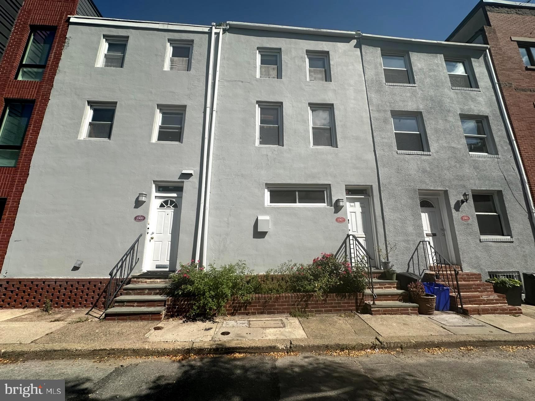Welcome to 1907-9 Rodman St! This lovely 2+1 Duplex is located on a small quiet street just a few blocks from Rittenhouse Square. Unit #1: This stunning 2bdrm unit offers three levels of bright rooms, tons of storage space, laundry-in-unit, a balcony, hardwood floors and a private back patio. Enter into the main level, which includes a kitchen with island and tons of cabinet space, and breakfast nook. There's additional pantry space, and access to your back patio on this level. The next floor is a bright living space, with a floor to ceiling window letting in lots of natural light. The third floor has two bedrooms and the full bathroom. One bedroom is larger and features white rafters overhead, a balcony with a long row of windows, and a ceiling fan for added comfort. The smaller bedroom is pictured as an office space, perfect for working from home! Unit #2: Enter into the living area with hardwood floors and great sunlight. The open floor plan provides a bright and airy atmosphere, and your kitchen is towards the back. Kitchen features include elegant beech cabinets, custom tiled backsplash, and stunning quartz counter tops with a copper sink and polished brass faucets. Stainless steel appliances include a designer gas range, refrigerator, and built-in microwave. The washer and dryer set includes a top of the line front loading HE washer. Continue up a few steps to view your bedroom and bathroom on the 2nd level. Head into your bedroom offering a large built in closet and an alcove adjacent to it for an additional free standing closet. Your tasteful bathroom boasts slate colored mosaic tiles, brushed nickel towel rails, and a full bathtub. Head into your bedroom offering ample space and a closet with sliding doors. You'll have your own, private patio (8 X 16 ft), offering a delightful space to enjoy the warmer months. This incredible property comes equipped with central air and gas forced air heating to ensure year round comfort. Call for a tour today! *About The Neighborhood: Rittenhouse Square is a fantastic neighborhood in Philadelphia, walking distance to countless shopping, eating, and entertainment options. Close proximity to public transportation bus routes for easy access throughout the city. Walkable to South Street, Graduate Hospital, Marian Anderson Recreation Center, and the Christian Street YMCA. Nearby incredible local restaurants, bars, and cafes including Southgate, Lou Bird's, Loco Pez, Ants Pants Cafe, Bob & Barbara's Lounge, Founding Fathers Sports Bar, Miles Table, and SO many more!