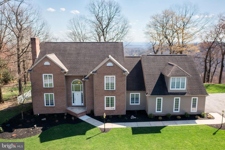 Stunning views- from this beautiful Derry Township home situated on over 3.5 acres. The grand two story foyer welcomes you into the home. Enjoy entertaining? The open concept kitchen and family room will be where friends and family gather.  The spacious kitchen offers loads of counter space for food prep, upgraded countertops and beautiful white cabinetry.  The cozy breakfast nook is the ideal space for casual meals or for completing homework. It is surrounded by windows overlooking the well-manicured back yard and the views! The formal dining room is ideal for holiday meals and offers indoor/outdoor living by opening onto the back deck. The stately living room will be an ideal spot to enjoy a good book by the fireplace. Working remotely? The first level office will be the spot for you. It is attached to a full bath and could double as an in-law suite. Down the hall is the first level laundry/mud room- a perfect space for backpacks and shoes. 
Retire to the primary bedroom on the second level. It offers privacy, and an ensuite with heated marble floors - almost makes getting up in the. winter enjoyable! In addition, it has dual sinks and a soaking tub, plus two walk-in closets with enough space to please any shopper! The guest room has its own full bath and two good size additional bedrooms share a third full bath.  The finished third level can be used as an exercise room, a play room or a bedroom. It also offers a full bath and several closets. The lower level can accommodate a crowd with its large recreation room. It also has loads of unfinished space- ideal for holiday decor and seasonal items. No need to scrape ice and snow from your vehicle with the oversized, attached 3 car garage. The driveway offers several spots for additional parking. Enjoy outdoor living? The back patio, spacious yard or composite deck with a retractable awning will be the spot for you. Play a game of catch or host a barbecue in the scenic and private back yard with mature, professionally maintained  landscaping. Located on a quiet cul de sac just 3 miles from Hershey Medical Center and minutes Harrisburg International Airport and Amtrak Station, highways and Hershey Schools. Did we mention the spectacular day and nighttime views?! This home is a Must See!