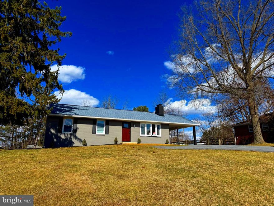Come see this 2025 Renovated 3-bedroom brick front Rancher located in sought after Howard County (top rated Howard County schools!).  Situated on over a 1/2-acre level lot, you'll get country living minutes from I-70, Rt. 27, Rt 97 and all the shopping and amenities in Mt. Airy.   Inside you'll enjoy a new kitchen, complete with quartz countertops, tiled backsplash, stainless appliances, a gas range/oven, and built-in microwave.  All new Luxury Vinyl Plank flooring leads to the living room featuring a shiplap wall with built-in electric fireplace and flat screen TV.  The living room features a large bay window to provide plenty of light in addition to all new recessed lighting throughout the home. The main level has three bedrooms and a beautifully renovated, dual sink vanity full bathroom for first floor one-level living. The lower level is partially finished with laminate flooring, heating and cooling, electrical outlets and a finished laundry room including a utility sink.  The lower level is ready to be used as-is for additional living space or has the possibility to add a bedroom(s) and/or an additional full bathroom.  The lower level includes a rear entrance with steps up to the backyard.  The large backyard features three out-buildings that can be used for additional storage, workshops, and many other uses.  The home features a 200-amp service and a 20K watt generator, so you never have to worry about being left in the dark.  Come see this home today!