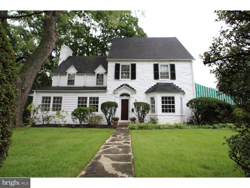 New Price & Ready for Quick Settlement,this is Main Line Living at its Finest! Tucked away on a quiet,tree-lined street in Ardmore sits this gorgeous Georgian Colonial that's the epitome of charm and character! Far from cookie-cutter,this hidden gem features 3 stories of beautiful living space with 4 bedrooms,3.5 bathrooms,enclosed sun porch and elegant living room. In an award winning school district and conveniently located close to area shops,restaurants and major highways. Suburban Square is just a short walk away! Situated on a large level lot with a private sweeping driveway, with a detached 2-car garage, and provides a great amount of parking space! A classic Lord & Bunham Orly greenhouse, with raised planting beds, is perfect for those with a green thumb. Sit back and relax on the lovely side patio with a French provincial style awning that provides much-needed shade in the warm summer months. Enter through the front door and you will be welcomed by the large foyer, with a coat closet and powder room. As you turn, you will be impressed by the classic focal points in the living room; the elegant hand carved fireplace, flanking bookcases and antique mirrored showcases. The enclosed sun porch is just off the living room. The original hardwood flooring located throughout the home,has been well cared for and in excellent condition! Entertain your guests in style in the impressive dining room drenched in natural lighting. Custom crown molding, chair rail and huge bay windows finish this room elegantly. Two separate glass doors provide easy access to the covered patio for outdoor entertaining. The spacious eat-in kitchen has copious amounts of cabinet and counter space, and also has a backyard access door. This kitchen is beautifully vintage but will easily update with your own personal style. Ascend upstairs to the vast master suite complete with gleaming hardwood flooring, large closet and master bathroom. Bathroom includes wainscoting black & white tile walls and classic mosaic chip marble floors with a 2 person walk-in shower. Two more very spacious bedrooms with custom built-ins, full bathroom with shower/tub combo & large linen closet complete the second floor. The third level has been converted into a second master suite featuring a private full bath, cedar closet and huge attic closet for clothing or storage.The updated private bath has a mint-condition,claw-foot tub, which is the perfect retreat after a long day! Schedule your private tour today!