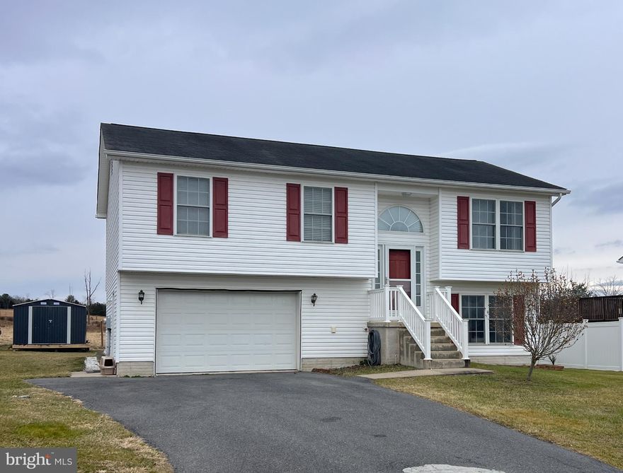 Discover the charm of this delightful split foyer home, nestled in a serene cul-de-sac and surrounded by breathtaking mountain and pasture views. Built in 2008, this home offers a perfect blend of comfort and functionality, making it an ideal retreat for those seeking a peaceful lifestyle. 

Step inside to find an inviting open floor plan that seamlessly connects the living, dining, and kitchen areas. The spacious living room features carpeting and ceiling fans, creating a cozy atmosphere for relaxation. The well-appointed kitchen boasts new stainless steel appliances, including a built-in microwave, dishwasher, and refrigerator. And electric oven/range. Enjoy meals in the combination kitchen/dining area, where natural light pours in, enhancing the warmth of the space. This home features three comfortable bedrooms, including a primary suite with an en-suite bathroom, ensuring privacy and convenience. The additional full bathroom is thoughtfully designed with a tub shower. 

Outside, the property shines with a lovely covered deck and patio, ideal for entertaining or enjoying quiet evenings under the stars. The attached garage and ample driveway space provide plenty of parking for guests. A charming storage barn/shed adds extra storage. Experience the perfect blend of indoor comfort and outdoor beauty in this home. 

This home is close to the National Forest, great hiking trails and just minutes from Trout Pond Recreation/Rock Cliff Lake with swimming, kayaking, fishing and camping. Just seconds from downtown, charming Wardensville with shopping and dining.