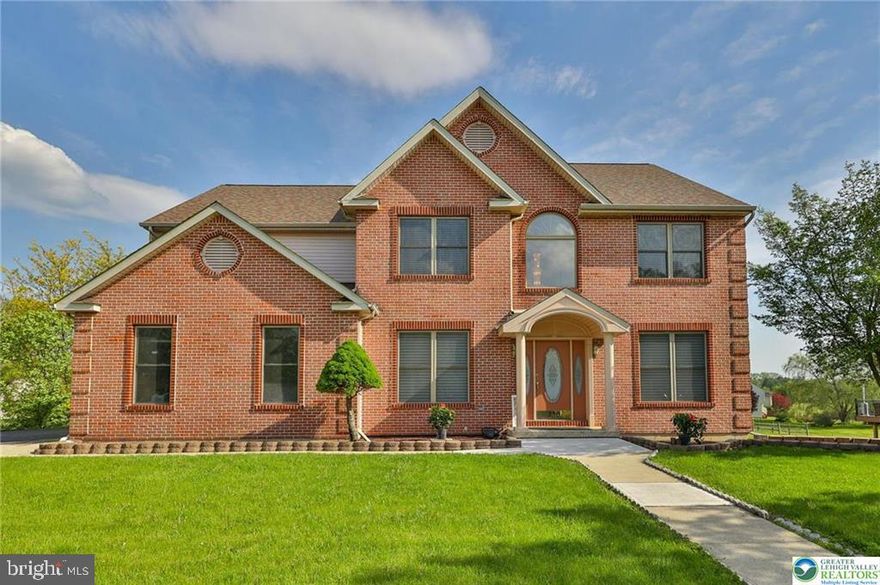 First time ever offered in the highly sought-after Heatherfield subdivision of Parkland. This elegant brick-front Montclair model is beautifully set on a nearly half-acre lot in one of the Lehigh Valley’s most desirable locations. A covered front porch welcomes you into a dramatic 2-story foyer and impressive family room with soaring ceilings, gas fireplace, and scenic backyard views. The fully renovated kitchen is a true showpiece, featuring modern finishes, center island, built-in walk-in pantry, and a wall of windows that fills the kitchen and main living areas with bright and cheery natural light. The main level also offers a flexible office/den with an adjacent full bathroom, ideal for guests, work-from-home needs, or possible future bedroom use. Upstairs, you’ll find 4 spacious bedrooms, second-floor laundry, a dual-sink hall bath, and a generously sized primary suite with tray ceiling, walk-in closet, and spa-like bath with soaking tub and separate shower. The bright finished daylight lower level adds exceptional living space with a full bathroom, expansive recreation area, and an additional finished room perfect for a gym, hobby room, office, or private retreat. Outdoor living is equally inviting with a huge deck, oversized backyard, side-entry 2-car garage, side entry door, extended driveway, and expansive concrete patio enhanced by decorative white post lights that add charm and a relaxing ambiance for evening enjoyment and outdoor gatherings. Notable updates include a brand-new roof, Rheem water heater, Rheem water softener, newer flooring, renovated kitchen, and more. No HOA. A rare win-win opportunity that truly checks all the boxes for today’s buyers, offering the perfect blend of location, layout, comfort, and convenience for modern living.