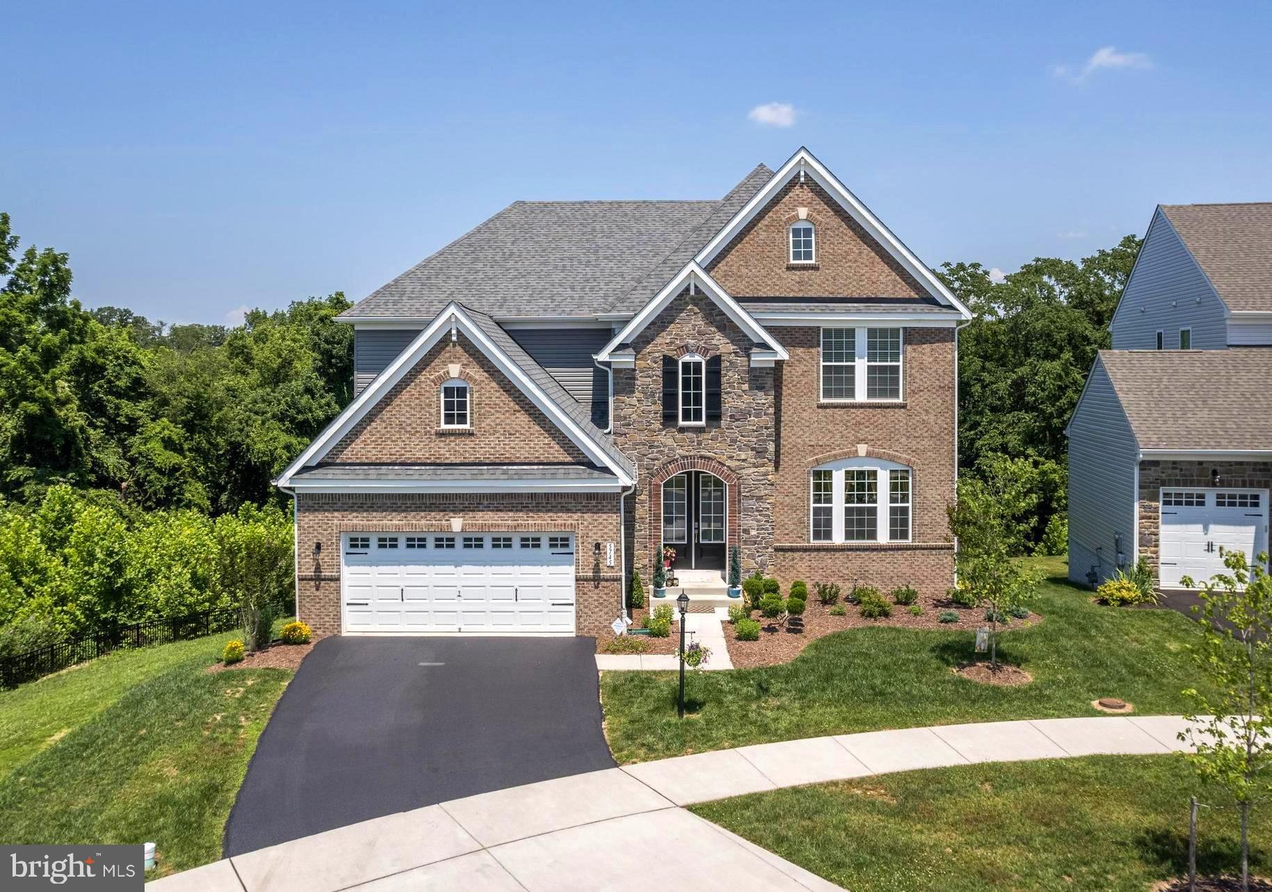 Welcome to a piece of paradise so close to shopping and dining in downtown Frederick in the highly sought after Tallyn Ridge Community. This classic Rowan B model comes with all the best upgrades including a first floor bedroom and bath, upgraded chefs kitchen including a Wolf Professional double oven, custom coffered ceilings in the dining room and upgraded lighting by Schonbek to add to the elegance and sophistication of this home. The lot backs to parkland and is enhanced by a double balcony to enjoy the scenery throughout the year and even has a custom stone wall with outdoor gas fireplace to add to the enjoyment on those cool evenings. The basement features upgraded 9’ ceilings with plenty of natural lighting and also has a full bathroom and bedroom with a custom wet bar including an under counter refrigerator. The main level features custom archways with 10’ ceilings while the upstairs features 9’ ceilings along with a master bedroom with a massive walk in shower. The house has a total of 6 bedrooms and 5 full bathrooms. All the upgrades including landscaping front and back with a black aluminum fence. This is a unique luxury property offering the convenience of a community with privacy and seclusion to be enjoyed with the parkland view
