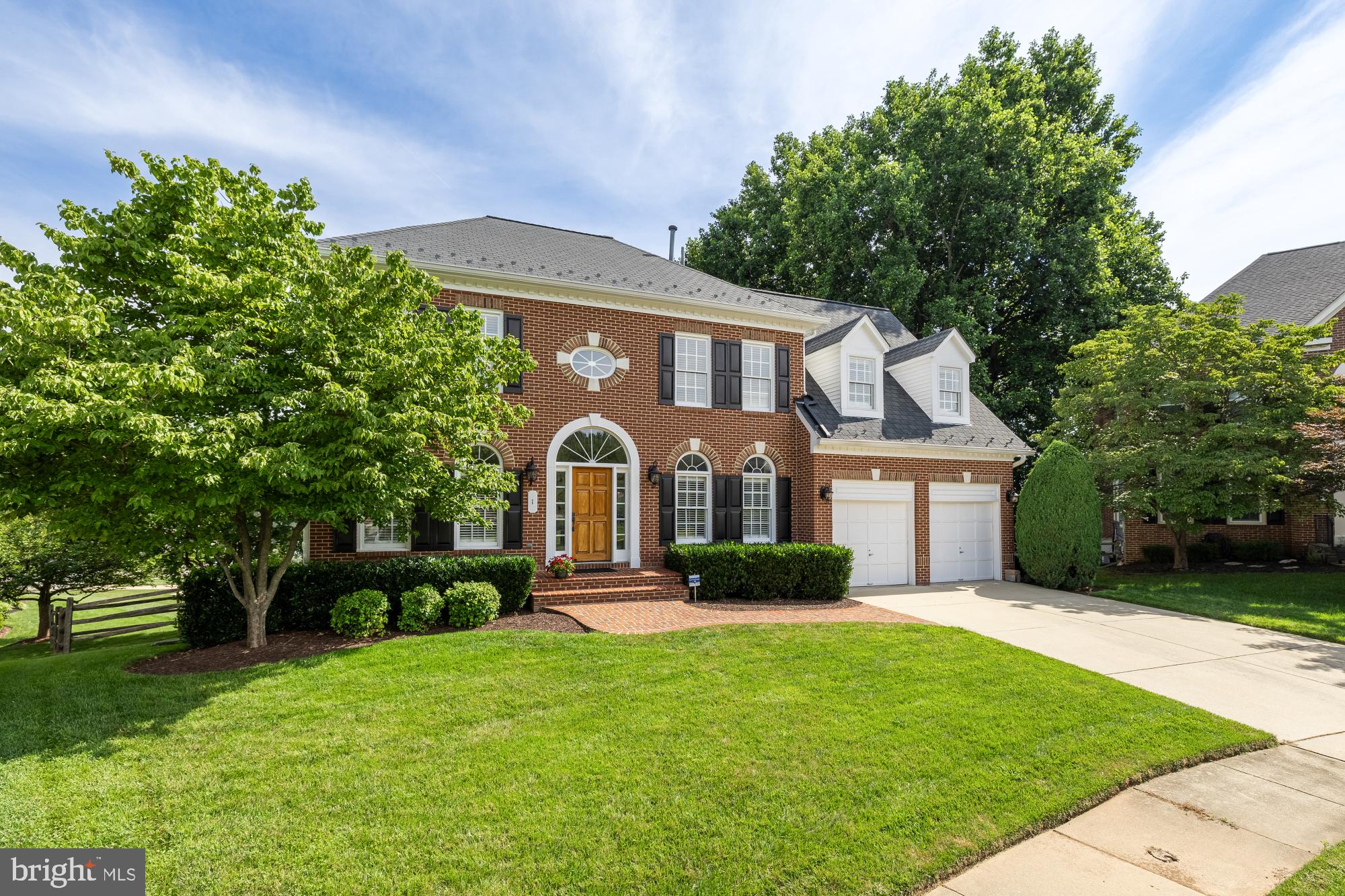 Tucked away on a peaceful cul-de-sac in one of Montgomery County’s most sought-after neighborhoods, this, one owner, stately and lovingly cared-for colonial offers the best of all worlds—5 spacious bedrooms, 3.5 bathrooms, and over three full levels of thoughtfully designed living space that blends timeless elegance with modern upgrades.
From the moment you step inside, the warmth and character of reclaimed antique solid white oak floors, sourced from Cochrane’s Lumber in Berryville, VA, greet you with a story of craftsmanship and care. The two-story grand foyer sets the tone, leading you into a dedicated home office, formal living and dining room, and—at the rear of the home—an open-concept kitchen and family room made for both entertaining and everyday living.
The gourmet kitchen is a true showstopper. Thoughtfully remodeled to delight any home chef, featuring professional-grade KitchenAid appliances, Cambria quartz countertops, dual sinks, full-height soft-close cabinetry, and a custom copper range hood that makes a statement. The centerpiece? A stunning solid white oak island top that’s both functional and beautiful.
The kitchen flows effortlessly into the informal dining area, complete with accented cabinetry and access to the upper deck—ideal for sipping your morning coffee or enjoying dinner al fresco. Just beyond, the cozy family room with vaulted ceilings, custom built-ins, and fireplace making this the perfect spot to unwind on chilly evenings.
Upstairs, you’ll find a large primary suite with a just-completed spa-like bathroom, showcasing designer tile, a double vanity, an oversized shower, and a dreamy modern freestanding soaking tub. Three additional, generously sized, bedrooms are maintained on this level and share a recently refreshed full bathroom, offering plenty of space for family or guests.
The walk-out lower level is where the home really flexes its versatility given its full sized windows. Currently used as a second living space, it features a custom wet bar, a full bathroom, and a fifth bedroom with double closets—perfect for guests, teens, or in-laws. Whether you imagine a home gym, game room, theater, or all of the above, this level is ready for whatever you dream up.
Step outside to a lush backyard with two-level entertaining spaces—an upper deck off the kitchen and a beautifully designed hardscape patio with built-in lighting, perfect for gathering with friends or enjoying a quiet night under the stars.
Additional perks include a two-car garage, a large basement storage room a premium lifetime warranty roof, and even a shed tucked neatly beneath the deck for all your gardening gear and seasonal décor.
Located in the charming James Creek community within Olney providing quick access to top-rated schools, hospitals, grocery stores, and restaurants, and with easy commuting to both Washington, D.C. and Baltimore, 1 Littlebrooke Court is the perfect blend of location, lifestyle, and laid-back luxury.