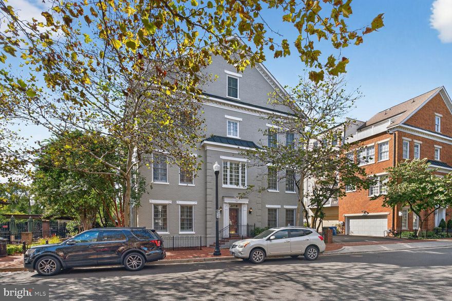 Location, Convenience, Walkability, and a True Sense of Community — Welcome to Potomac Greens!
One of Alexandria’s most sought-after neighborhoods, Potomac Greens is ideally located just minutes from Old Town, surrounded by restaurants, shopping, and everyday conveniences — all within easy reach and walkable charm.

This majestic all-brick end-unit townhouse offers approximately 2,700 square feet of well-designed living space across four spacious levels, perfectly suited for a variety of lifestyles.
Enter through the two-car garage or main side entry door into a generous foyer leading to a versatile space ideal as a home office, or recreation room.
The main level open-concept living featuring a large kitchen with an island, granite countertops, stainless steel appliances, and ample cabinetry. Enjoy both casual and formal dining areas, a powder room, and a light-filled living space with custom built-ins and a cozy gas fireplace. Hardwood floors, high ceilings, and large windows with custom shutters on three sides flood the home with natural light and warmth.
The third floor  primary suite features a spacious bedroom, walk-in closets, and an en-suite bath. A second bedroom also offers an en-suite bath and closet. Laundry is conveniently located on this level with a newer washer/dryer.
Fourth floor includes private retreat with a third bedroom, full bath, and an additional living space — perfect for guests, media room, or home office — opening to your **own rooftop
Recent Updates: The main floor HVAC system just replaced (9/2025) and the second system is just a few years old (2021).  The entire exterior of the townhouse has just been painted (9/2025) as part of the maintenance.
Residents of Potomac Greens enjoy a wealth of exceptional amenities, including a clubhouse with meeting and event space, a well-equipped fitness center, an outdoor heated pool, pocket parks, tot lots, and scenic nature trails. Ideally located just steps from the new Potomac Yard Metro, this community offers unparalleled access to Amazon HQ2, Virginia Tech’s Innovation Campus, the George Washington Parkway, the Mount Vernon Bike Trail, and major commuter routes including I-495, I-395, I-95 and  I66. With only two traffic lights to downtown D.C. and Reagan National Airport, Potomac Greens offers a rare blend of elegance, lifestyle, and convenience—all in one of Alexandria’s most desirable neighborhoods.
Welcome home!