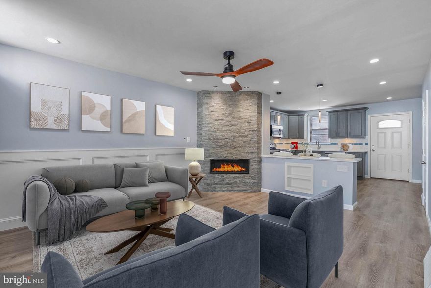 Impeccably maintained and beautifully presented, this 18 foot wide three story corner property offers four bedrooms, two full bathrooms, a finished basement, and a spacious rear patio with convenient street access.

Step inside to an inviting open concept living and kitchen area, anchored by a stunning stone front fireplace and a large picture window that fills the space with natural light. The chef’s kitchen is a true showpiece, featuring oversized quartz bar seating, stainless steel appliances, abundant shaker cabinetry, tiled backsplash, under cabinet lighting, and ample prep space. From the kitchen, step out to your private backyard oasis, perfect for gardening, entertaining, or summer barbecues. A vinyl patio gate provides direct street access, making it easy to store bikes or bring in groceries. A spacious coat closet is conveniently tucked away just off the kitchen.

The finished basement offers generous ceiling height and endless possibilities, whether you envision a home office, gym, playroom, or media room. Additional features include a laundry closet, custom built-ins, and storage under the stairs.

Upstairs, the second level features two comfortable bedrooms, a full bathroom with a glass shower and soaking tub combo, and a linen closet. The third floor hosts the serene primary bedroom, a modern bathroom with a glass enclosed stand up shower, and a bonus bedroom ideal for a nursery or home office.

Recent upgrades include a new HVAC system installed in 2023, custom closets, and professionally deep cleaned ductwork throughout.

Located just five minutes from Rittenhouse Square, this home offers an unbeatable location with a Walk Score of 98. Perfectly situated in one of the city’s most coveted neighborhoods, this home offers effortless access to Rittenhouse Square’s premier dining, shopping, and nightlife, as well as everyday conveniences like Target, Sprouts Farmers Market, and Wine & Spirits. The nearby Schuylkill River Trail and seamless connectivity to public transit, Center City, the University of Pennsylvania, Washington Avenue, Broad Street, and I-676 make this location truly exceptional. Schedule your private tour today and experience city living at its finest. Some photos are virtually staged.