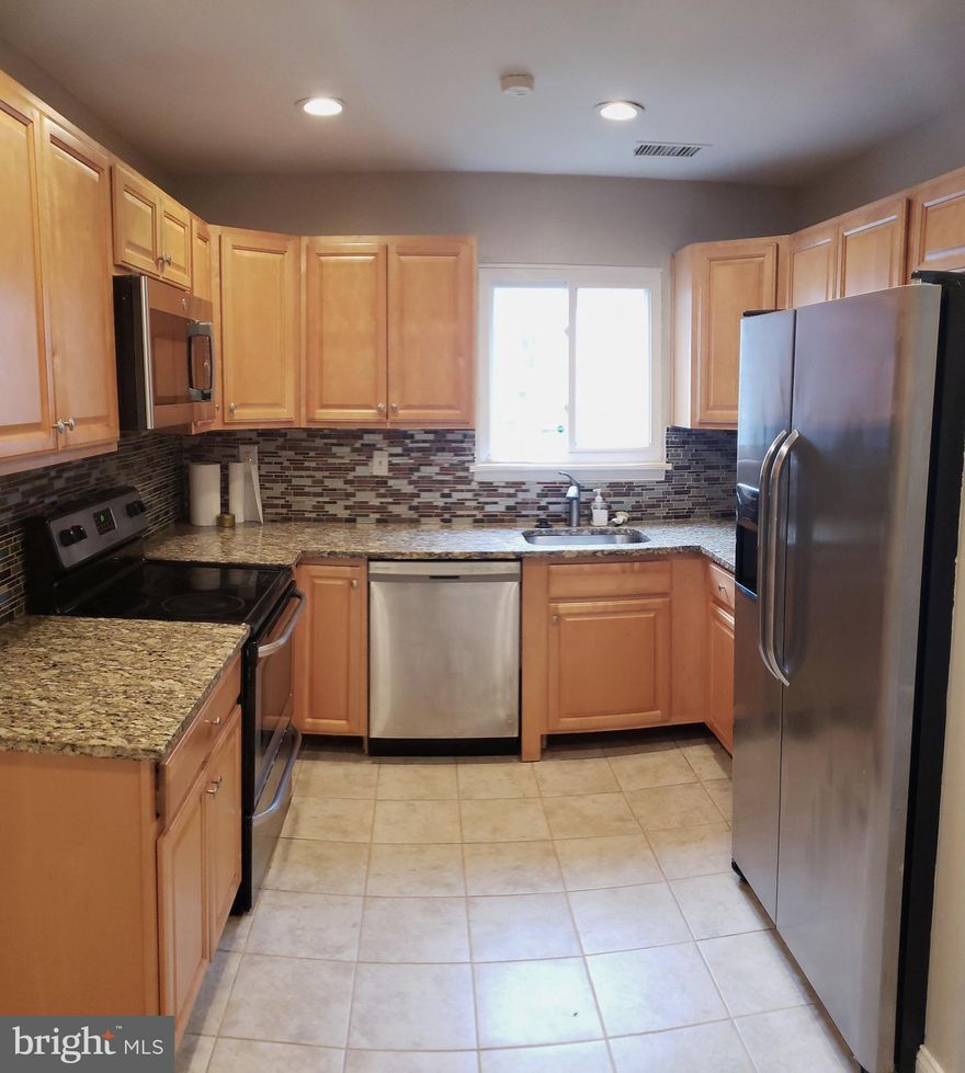 🏡 **Get $10,000 and Discover the Charm of 7507 Courtney Pl!**

Take advantage of an exclusive financing program offering a $10,000 credit for first-time homebuyers with credit scores above 620, covering your 3% down payment with NO mortgage insurance. (Contact the listing agent, for details)

Nestled in the heart of Hyattsville, 7507 Courtney Pl will captivate you with the promise of a dream home at an unbeatable price of just $320,000. Step into a world of comfort across two levels, where spacious bedrooms await, three on the upper level complemented by two full bathrooms. A half bathroom on the main level adds to the home's convenience, ensuring every aspect of daily living is effortlessly accommodated.

The kitchen, a focal point of modern living, boasts updated features such as granite countertops and stainless steel appliances, including a dishwasher, double-sided refrigerator, built-in microwave, and electric stove. Recessed lights bathe the space in a warm glow, while the entire home has been freshly painted, creating a canvas ready for your personal touch. Beyond the doorstep lies the convenience of assigned parking in an expansive lot, making every return home a stress-free affair. And with a prime location just a mile's walk to the Metro or a short drive to DC, the 495 beltway, and major routes, this residence effortlessly blends accessibility with style.

Embrace a lifestyle that seamlessly integrates modernity and affordability, with updated bathroom vanities and included washer and dryer. Picture your new life, where the pulse of the Capital Region Medical Center, Fedex Field, The Sports and Learning Complex and Prince George’s Community College are all within easy reach. Act now to turn the key to your future in this extraordinary home! 🏠✨