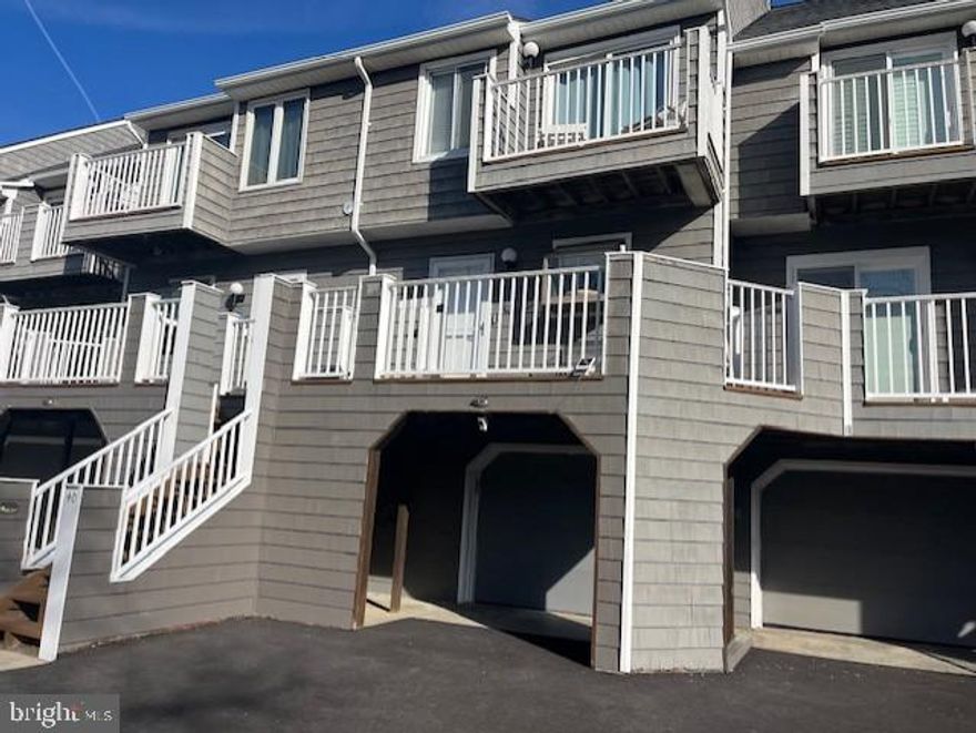 Welcome to the wonderful world of Harbour Island.  This beautiful, fully furnished townhouse is overlooking the pool and the marina.  This is the home of the famous White Marlin Open.  You can see the weigh scales from the deck of the unit.  The kitchen has granite countertops and stainless steel appliances.  In the dining area there is a wet bar complete with wine refrigerator and ice maker.  There is luxury vinyl flooring in the dining and living room area.  There is a wood burning fireplace for ambiance in the living room surrounded by beautiful built-in cabinets on both sides.  Two large bedrooms upstairs both have balconies for a of view sunrise and sunsets.  All bathrooms are newly updated.  In the garage area there is a large bonus room with bunk beds and a double bed.  Connecting to that bedroom is a full bathroom.  There are two sets of washer and dryers.  One in the garage area and one located on the second floor near the bedrooms.  Also, the unit is equipped with a water softener system that helps with hard water and calcium. 
 This is a 'must see" unit to appreciate how spectacular it is.  Boat slips available for purchase.