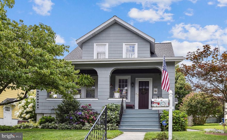 Offers due Monday 8/18 by 5pm. IMPECCABLY  maintained & updated craftsman style home with a BREATHTAKING landscaped backyard of perennial gardens, flowers & more, on a quiet block in Hamilton! Updated for today's living yet full of charm inside and out for a retreat-like setting.  The main level is a wonderful space for entertaining with a gorgeous living room/foyer that opens to a side family room and dining room; a fantastic renovated kitchen designed for the chef in mind, with a breakfast bar, Kraftmaid wood cabinets & pantry, plentiful countertops, & stainless appliances; gorgeous hardwoods, original unpainted wood trim  & a renovated full bathroom. The main level (3rd) bedroom is currently being used as a tv room with plantation shutters, and top-quality carpet (over hardwood). The upper-level features a large primary bedroom, a charming bedroom, pine floors and storage space.  The BEST unfinished  basement you'll see in this area - with waterproofing in place, tons of storage, super clean, insulated, and high ceilings (potential for finishing.) RECENT ARCHITECTURAL SHINGLE ROOF! The backyard will take your breath away with the extensive landscaping, spacious recent shed, koi pond and flowers planted by a master gardener. The rear deck off the kitchen has a recent high quality retractable awning - perfect for entertaining and keeping cool on summer days. Great home for a savvy buyer with an appreciation of aesthetics. Tired of your cookie cutter renovations? This one is for you!