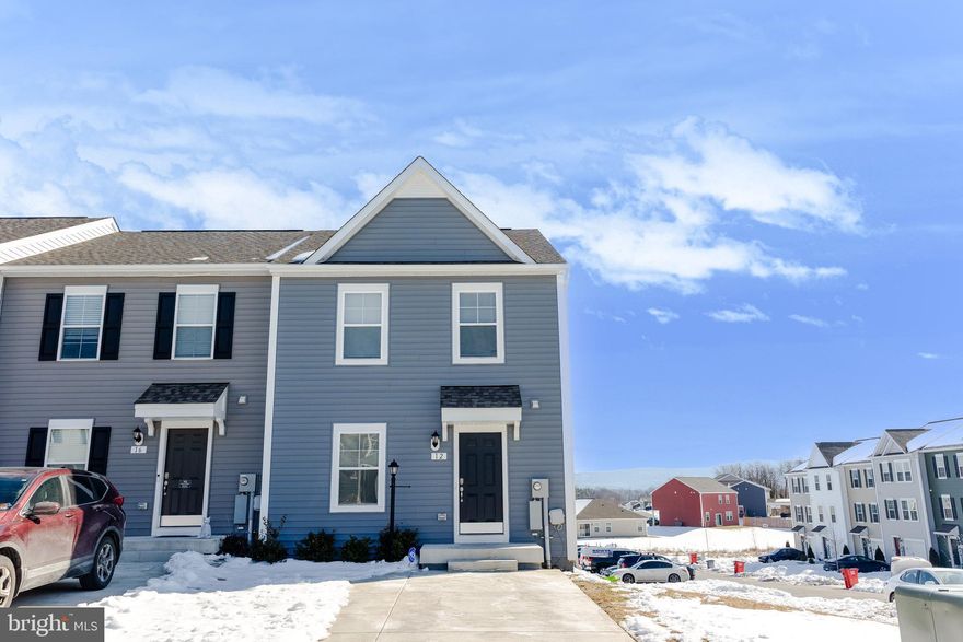 Discover an exceptional investment opportunity in the Townes at Tate Manor! This stunning end-of-row townhouse, built in 2023, offers a modern living space with 3 spacious bedrooms and 3.5 baths. The open concept design includes a kitchen with modern stainless steel appliances and a large island. The primary suite includes a walk-in closet and bathroom with a dual vanity, shower, and tub. This home is an excellent commuter location with proximity to Maryland and Virginia. The local community of Charles Town, WV, offers shopping, restaurants, and the famous local casino. Jefferson Memorial Park and downtown are within walking distance.