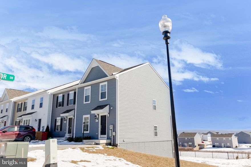 Discover an exceptional investment opportunity in the Townes at Tate Manor! This stunning end-of-row townhouse, built in 2023, offers a modern living space with 3 spacious bedrooms and 3.5 baths. The open concept design includes a kitchen with modern stainless steel appliances and a large island. The primary suite includes a walk-in closet and bathroom with a dual vanity, shower, and tub. This home is an excellent commuter location with proximity to Maryland and Virginia. The local community of Charles Town, WV, offers shopping, restaurants, and the famous local casino. Jefferson Memorial Park and downtown are within walking distance.