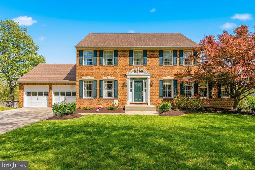 Beautifully maintained brick-front home in a sought-after Ellicott City location, offering a spacious and thoughtfully designed layout. The main level welcomes you with a formal foyer and open staircase, flanked by a dining room with hardwood floors, crown molding, and chair rail, and a versatile living room currently used as a library/office.

The kitchen provides ample workspace and cabinetry, complemented by a convenient butler’s pantry, and flows into a generous family room—ideal for everyday living and entertaining. A light-filled sunroom with palladium windows creates an inviting space to relax. A main-level half bath and first-floor laundry add everyday convenience.

Upstairs, the primary suite features vaulted ceilings, a walk-in closet, and a private bath with an oversized soaking tub, separate shower, and ceramic tile finishes. Three additional well-sized bedrooms and a full hall bath with a skylight complete the upper level.

The walk-out basement offers excellent potential with a plumbing rough-in, double door access, and space for future finishing. Additional highlights include Andersen Perma-Shield windows, an energy-efficient heat pump, insulated basement walls, and a recently serviced garage system.

Enjoy the outdoors on the wood deck overlooking the yard, all while being conveniently located near shopping, dining, and commuter routes.
