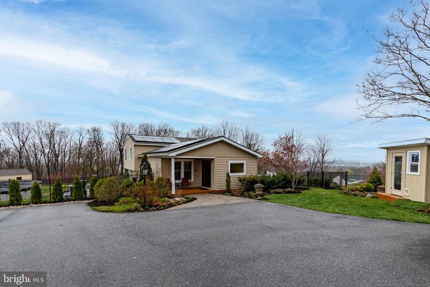 Prepare to be impressed!! From the minute you pull up the driveway, you will love this home and the location! Views for miles and miles! Brand new above ground pool just installed last Spring. Side deck plus built in fire pit for those chilly evenings. Brand new shed/garage for storage. Updated kitchen with SS appliances, granite counters, hardwood floors which opens to the main level living area. Soaring ceilings, recessed lighting, plus a built in desk/office space. Large family room in lower level. Spacious bedrooms. All baths have been updated. Brand new paint and carpet throughout. Simply perfect in every way!!