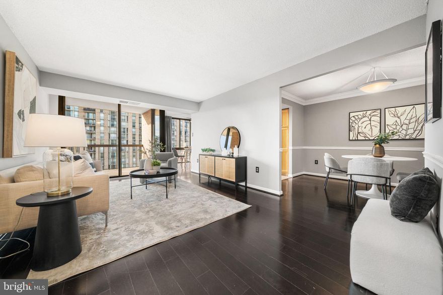 Welcome to The Four Mile Run Residence, a beautifully maintained, move-in ready 1 bedroom condo with a versatile den area in one of Arlington’s most connected locations. Floor-to-ceiling windows fill the home with natural light and highlight the open living space, complete with a separate dining area and an updated kitchen designed for everyday use and entertaining. The spacious bedroom features a walk-in closet, while the private outdoor balcony offers a peaceful place to unwind. Two assigned parking spaces and a dedicated storage unit convey. Residents of The Brittany Condominiums enjoy full-service amenities including a 24-hour concierge, fitness center, pool, tennis court, theater, and party room. Just a short walk to Shirlington Village favorites like Busboys and Poets, Carlyle, Copperwood Tavern, Palette 22, and nearby shopping, with easy access to I-395, Route 7, and Route 50.