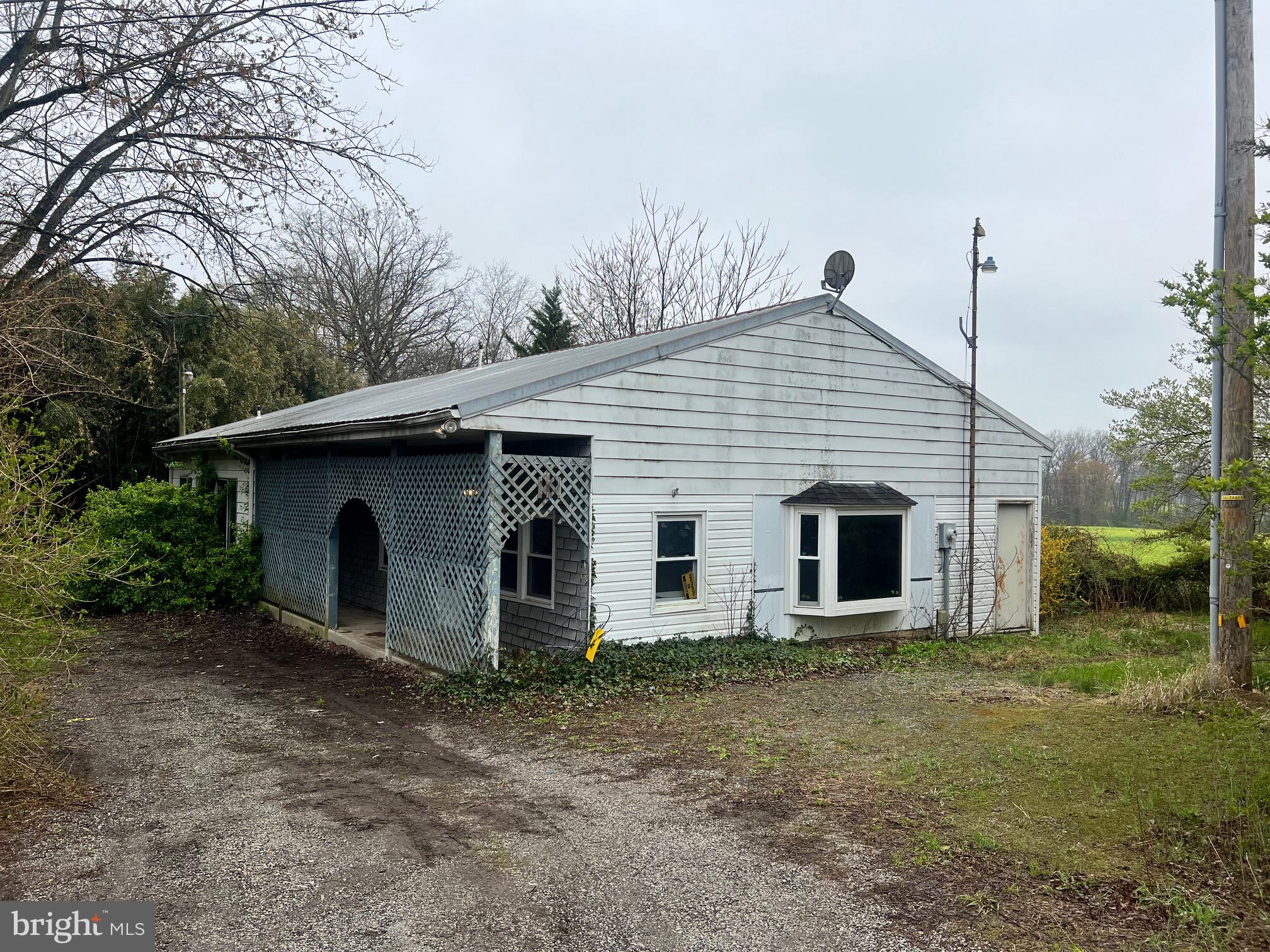 Situated on nearly an acre of rural land, this property offers outstanding potential for the savvy investor or builder. The existing mobile home with multiple additions is in need of significant renovation or replacement, making it an excellent candidate for redevelopment or value-add improvements. The spacious lot allows for future enhancements, additional structures, or a custom home build. Whether you’re looking to restore, reimagine, or rebuild, this is a rare opportunity to create lasting value. Sold as-is.