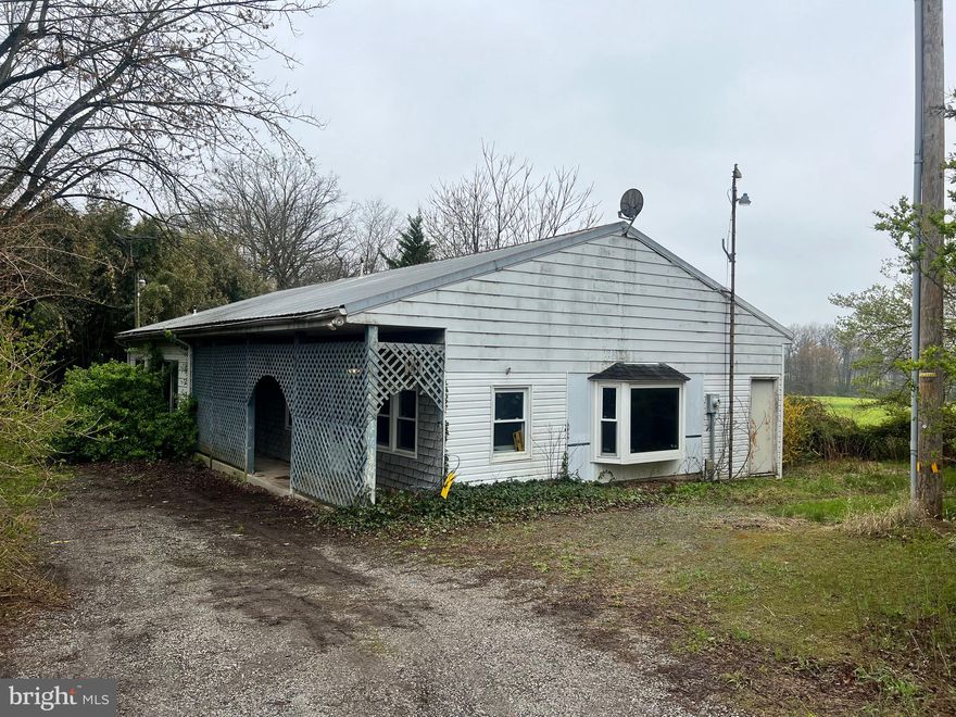 Situated on nearly an acre of rural land, this property offers outstanding potential for the savvy investor or builder. The existing mobile home with multiple additions is in need of significant renovation or replacement, making it an excellent candidate for redevelopment or value-add improvements. The spacious lot allows for future enhancements, additional structures, or a custom home build. Whether you’re looking to restore, reimagine, or rebuild, this is a rare opportunity to create lasting value. Sold as-is.
