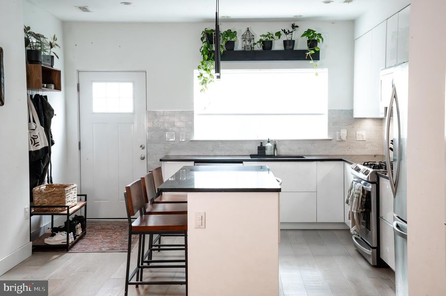 Welcome to 1137 S Sydenham Street—a contemporary townhouse on a quiet dead-end street, nestled in the vibrant Point Breeze neighborhood, just over a block from the Ellsworth-Federal Broad Street Line stop, and featuring no HOA. This 2,580 sq. ft. residence offers 3 bedrooms and 2.5 bathrooms, featuring wide-plank engineered white oak flooring, expansive windows that flood the home with natural light, a finished basement, and a kitchen equipped with an oversized island, stainless steel appliances, and ample storage. The primary suite boasts a spacious layout, walk-in closet, and a luxurious bathroom adorned with a handcrafted teak vanity and a teak bench in the shower.

Enjoy the convenience of off-street parking with a 2-car private driveway and the luxury of a 600+ sq. ft. roof deck that provides panoramic views of the Center City skyline—perfect for entertaining or relaxing under the stars. Additional highlights include a dual-zone HVAC system, high-efficiency furnaces, and 4 years left of a 10-year tax abatement already in place.

Situated in a developing area, the home is surrounded by restaurants, coffee shops, and boutiques in the Newbold and East Passyunk neighborhoods. The location offers excellent walkability to popular stores like Sprouts, PetSmart, Target, and Giant; enhancing the convenience and appeal of the area. 

This exceptional property combines modern design, premium amenities, and a prime location—schedule your private tour today to experience all that 1137 S Sydenham Street has to offer.