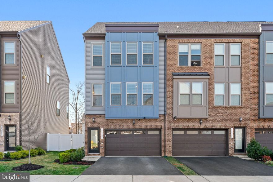 OFFER DEADLINE MONDAY, MARCH 25TH AT 12PM .  
Welcome to luxury modern living in Sterling! This stunning 3-bed, 3.5-bath end unit townhouse boasts 3 finished levels with over 2,300 sf. of space. High-end features include soaring 9’ ceilings throughout, custom plantation shutter sliders, an upper-level wifi-extender, motorized blinds in the stairwell, and built-in entertainment centers in both the family room and lower level. 

Custom wainscoting and trim greet you in the foyer, with seamless flow into the sun-filled open floor plan. An open-concept main level features a luxe kitchen, formal dining area, powder room, and living room with outdoor deck access. The gourmet kitchen is equipped with stainless steel appliances, dual wall-ovens, custom backsplash, upgraded countertops, an expansive center island and a coffee bar.

Upstairs, the primary suite is its own oasis, complete with a spacious walk-in closet and en-suite bathroom. Two additional upstairs bedrooms share a separate full bath. Downstairs, the finished walk-out lower level offers a bonus/rec. room and full bath, offering endless options for accommodating any lifestyle. 

An attached 2-car garage features built-in storage racks, Tesla charging port, rubber flooring, side storage access, and custom garage system. The private, fenced-in yard offers the perfect setting for outdoor entertaining in a dream location! Sitting just minutes from major commuter roads and the newest Metro stations, Dominion Trail offers convenient access to dining, entertainment, shopping, and the W&OD trail. Don't miss your chance to call this exquisite property home!