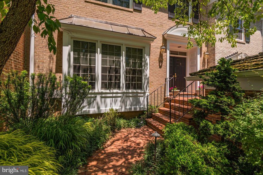 Privately nestled among the trees, backing to the 15th fairway of Avenel, this wonderful 4 level townhome features expansive entertaining space and multiple areas for enjoying the outdoors. The home opens with a formal living room with beautiful millwork and trim and a large window array to allow for tons of natural light. The dining room is one step up from the living room to give an open feel while still creating some delineation of the two spaces.
The rear of the home is perfect for social gatherings as the family room, kitchen and breakfast room all intertwined. The family room is complemented with a fireplace, beamed ceiling, and a full wall of windows. From the family room, the chef’s kitchen is well appointed with double wall ovens, built-in refrigerator, stone countertops, a large peninsula with seating for 4, as well as a breakfast area. Moving just outside of the rear of the home, enjoy an incredible screened in porch and patio which is quite private due to the landscaping and topography of the surrounding land.
The upper level has two guest bedrooms, laundry, and a large owners suite complete with sitting area, large walk-in closet with storage system and the bath suite is outfitted with a soaking tub, oversized vanity, shower, and water closet. One of the best features of the suite is the private terrace, perfect for enjoying mother nature.
Above the bedroom level, the 4th floor is finished, ideal as an office, family room, or gym with tons of storage, and a cedar closet! The lowest level is configured for recreation with a family room, full bath, and large storage area.