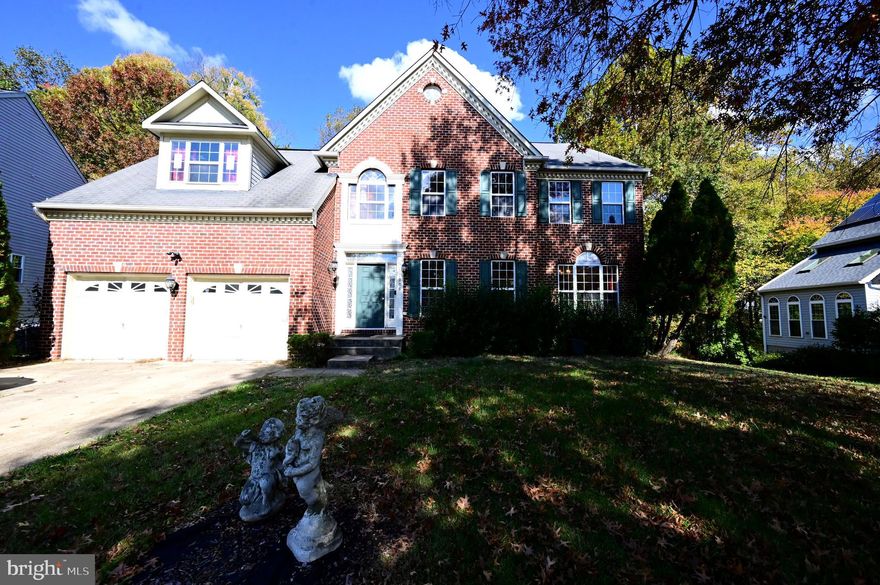 Luxurious over 4000 sq ft Single Family 6-bedroom 4.5-bathroom home in desirable quiet Bowie neighborhood seconds from Bowie Town Center Shopping, Resturants, Parks & Recreation, HWY 50, Crofton Shopping Center, Bowie Baysox Field, and Much Much More!! Features include a gourmet kitchen with granite countertops, sit-in island that faces a two-story ceiling boasting large windows for plenty of natural lighting. Flooring features hardwood, tile, and carpet throughout. The Living Room has a 2 Story stone accent wall with fireplace as centerpiece including surround sound pre-wire. The home has a 2-car garage with a large driveway, basement wet bar, spacious deck over stone patio facing woods. Private master suite has private  fireplace, walk-in closets, soaking tub, dual sinks, walk-in shower, and potential for a private deck. Princess bedroom has attached bath plus four large additional bedrooms perfect for big families or multigenerational living. Every bathroom has glamorous tile finishes. Laundry room features a mud sink and the main level has a large office that could easily be converted to seventh bedroom on the main level if desired. A uniquely designed living room facing the dining area shows both elegance and luxury. To sum it up- the property boast spacious interiors and elegant features throughout. Don't hold back - call this one home today & Schedule your private tour!