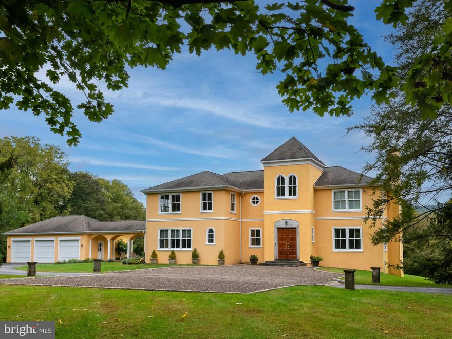 Do you like the feel of an Italian Villa? Look no further! This gorgeous and meticulously maintained custom Hallowell built home is offered for the first time. Sitting on 6+ beautiful acres, this home offers the serenity of a Country Estate. Drive up the private lane to the hilltop where the house looks like one found in Tuscany. Enter the welcoming & bright foyer that boasts fabulous views of Mother Nature from all angles. Conserved land is out back, the side yards are wooded and private and the front yard is large & flat. Inside, hardwood floors are on both levels and the windows are expansive creating a luxurious feel throughout the house. The huge foyer opens up to the family room in the back, the living room to the right and the formal dining room to the left. You will ooh and aah in these rooms - especially the family room. The entire  back wall of this room is a wall of glass - a combination of windows and the door for entry to the brick patio. On this patio is a trellis with a mature trumpet vine that draws Hummingbirds when the flowers bloom. From the family room, turn right into the formal living room boasting a wood-burning fireplace and plenty of large windows. Or turn left from the family room which flows right into the gourmet kitchen. This updated kitchen has newer quartzite counter tops, sub-zero refrigerator, double wall oven, an island with plenty of storage, built in shelving for cookbooks and ample wood cabinetry for storage. The mosaic tiled back splash is hand made by a local artise who was trained in Italy. The kitchen is truly a visual delight as well as a chef's delight. From the kitchen enter the formal large dining room with chair rail and windows overlooking the front of the house. The laundry room, pantry closet, second powder room & mud room are all off the kitchen. From this area you can access the over-sized 3-car garage via the breezeway. Enjoy warm days and nights sitting on this breezeway as the views are all of Mother Nature. The second level of this home features four bedrooms, two full baths, an office with built-ins and a reading area in the “Tower”. Greet the sunrise from this area as the two windows allow for lots of light. The primary carpeted bedroom boasts a Juliette balcony, walk-in custom closet and full bath. The bath has a tub, 2-sink vanity and the stall shower is newer. Three more bedrooms complete this level as does the full hall bath. This room has a storage closet, 2-sink vanity, private room for the tub and loo. There is an additional room on the second level which is currently in use as an office as it features beautiful built-in shelving. The carpeted lower level is finished, Enjoy the Bar complete with refrigerator, sink and entry to the dedicated wine cellar. There is another full bath with a stall shower on this level and a bonus room. The unfinished area completes this level as the systems and extra storage are in this area. Close to major highways, restaurants & shopping. If you like land and want the award winning T/E School district - this is it!