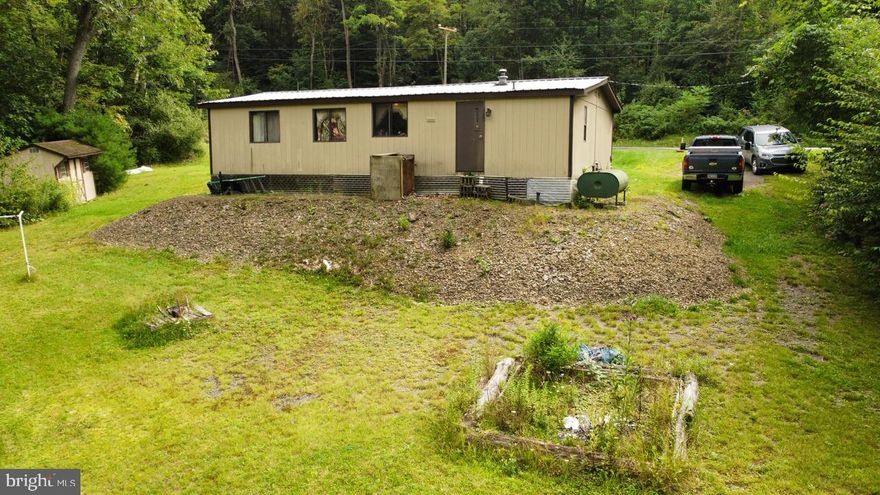 A 3 bedroom, 2 bathroom home along a quiet road in Clearfield County. Mature trees on and around the property create the peaceful and private backyard you have been searching for. The interior offers a large master suite with an attached bathroom and an open concept living room and dining room. Ideal for a hunting camp or with some TLC would make a perfect year round residence.