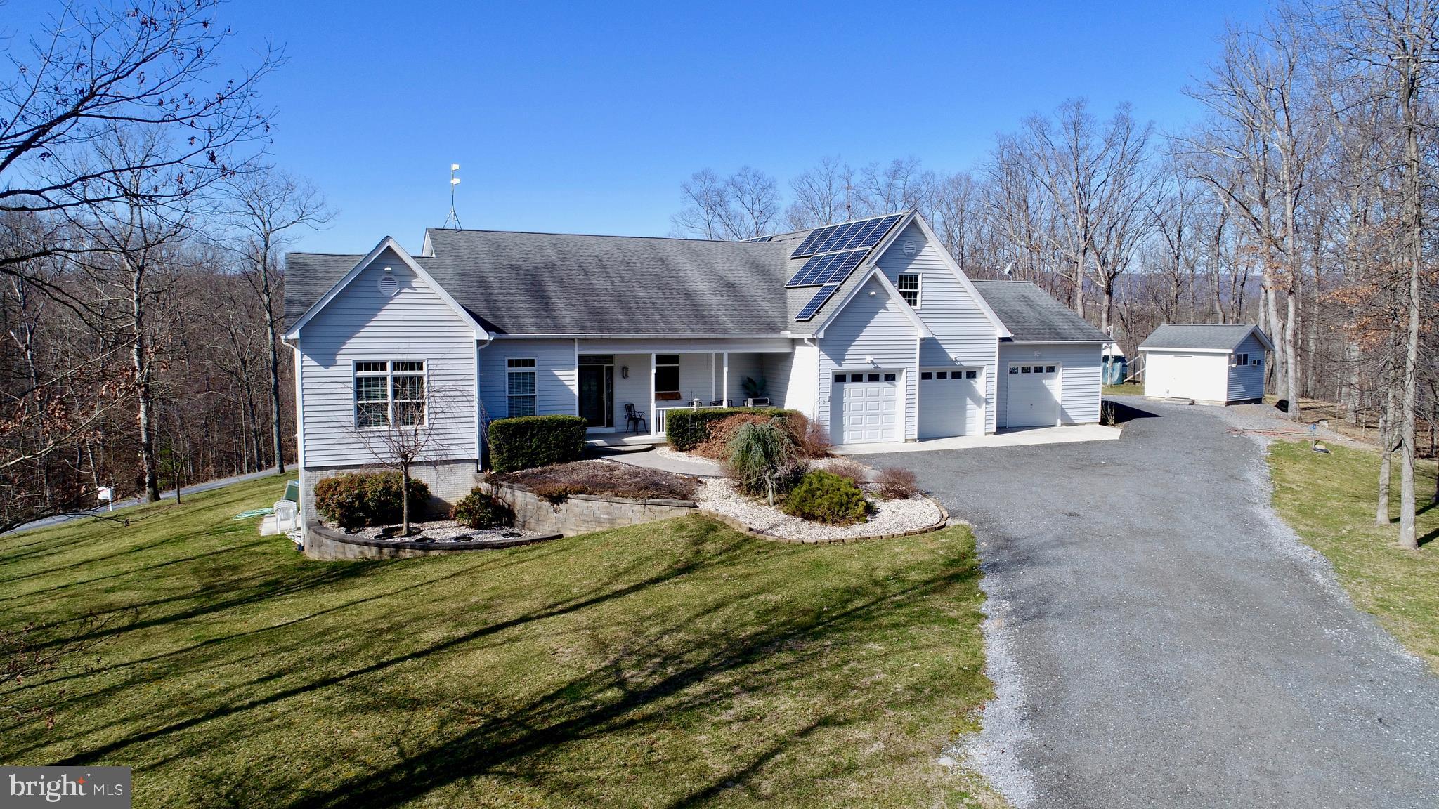Beautiful Private Retreat on 5 acres! This 3 Bedroom, 3.5 Bath Custom Built home boasts 3300 sq ft of living space and custom features abound. Providing an open floor plan, this home features: 9 Ft. Ceilings, radiant floor heat, an indoor endless pool, Geothermal 5 zone heat pump and 2 zone cooling, and solar power for low utility costs! All Bedrooms are conveniently located on the 1st level including the Master Suite with spacious walk in closets. The Gourmet kitchen w/ Jenn-Air Gas cook top and built in wall oven flows beautifully to the Family Room. Main level also includes a private Office, Sunroom, and oversized laundry/mudroom. Upper Level is home to a grand 1000 sq ft finished space with endless opportunities such as a craft room, additional bedroom(s) or game room and includes a half bath (plumbed to be converted to a full bath!) Unfinished lower level is ready for you to customize and add even more entertaining space for family and friends! Visible amenities include: 5-channel surround sound system, fenced in garden area, a 20x30 attached workshop, a 16x24 barn, 8 kilowatt generator, whole house battery back-up/surge protection, power outage alarm, solar screens and Central Vacuum as well as hidden features such as an invisible fence for dogs! If you are looking for added acreage please see our other listing which includes an additional 5 acres -WVBE175532