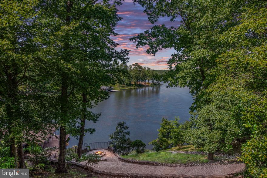 LOCATION & WATERFRONT!
An exceptional and rare opportunity to own a stunning waterfront home on the public side of Lake Anna! Perfectly situated in a central location, this property boasts approximately 200 feet of deep-water shoreline in a peaceful no-wake zone, offering views of the Rose Island area of Lake Anna. 

The sellers have thoughtfully lowered the price to give new owners the freedom to choose their own finishes, colors, and design preferences on upgrades/updates as they deem fit. Home is fully functional as it is now. 

This extraordinary lakefront gem is a rare find and features 6 spacious bedrooms, 5 full bathrooms, and 1 half baths, all complemented by the convenience of a private elevator.

The main level offers a bright and open floor plan with a cozy sitting area and gas fireplace, an open-concept kitchen, and incredible water views. You’ll also find a main-level laundry area, three bedrooms, and 2.5 baths. Step outside onto the expansive full-length deck, complete with a screened-in porch, perfect for relaxing or entertaining.

Take the stairs or elevator down to the lower level, which opens to a spacious game and lounge area—billiard table included! Each wing of the lower level has its own bedrooms, bathrooms, and an additional laundry area for ultimate convenience.

Outside, follow the paver path down to the lakeside patio and firepit, or continue to the boathouse. The boathouse features two boat slips with lifts, a covered seating area, and a storage shed, offering everything you need for lake life.

Don’t miss your chance to own this unique piece of Lake Anna paradise—opportunities like this are few and far between!