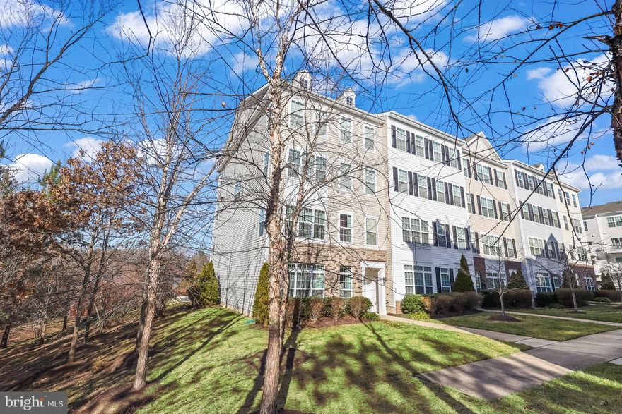 ***OPEN HOUSE SATURDAY, JANUARY 10, 2026 FROM 1-3 PM!***  Welcome to this beautifully maintained end-unit, two-level condo filled with extra natural light thanks to its desirable corner location. The main level offers a spacious family room that flows seamlessly into the dining area—perfect for entertaining—along with a separate office ideal for working from home. The kitchen features a cozy sitting area along with space for a kitchen table and convenient access to the deck, making it easy to enjoy outdoor grilling and relaxation. Upstairs, you’ll find three bedrooms, including a generous primary suite with peaceful tree views, a huge walk-in closet, and an attached primary bathroom. This home is conveniently located just minutes from Wal-Mart, Aldi and other grocery stores, restaurants, and everyday essentials. Enjoy nearby recreation at Ali Krieger Sports Complex, Brittany Park, and other local parks, plus easy commuting with close access to I-95, Route 234 commuter lot, OmniRide Connect, and the Rippon VRE Station. Schedule your tour today and see all this end-unit condo has to offer!