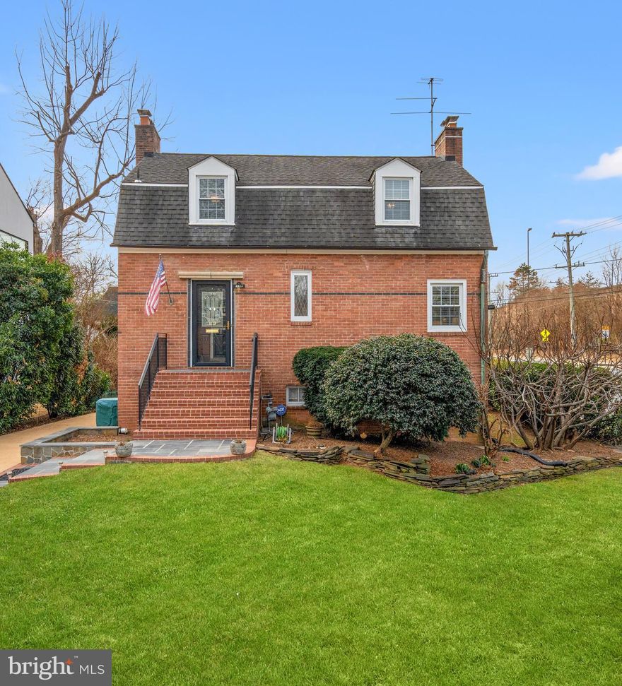 Situated on a prominent corner lot in highly coveted Lyon Village, this sun-drenched brick Colonial beautifully balances classic architectural character with thoughtfully designed, versatile living spaces across three finished levels.

A welcoming main level introduces a formal living room adorned with gleaming hardwood floors, elegant crown moldings, and a wood-burning fireplace that creates a warm, inviting focal point. Two well-proportioned bedrooms—including a primary bedroom—and a full bath on this level offer exceptional flexibility for main-level living, guest accommodations, or a private home office.

The lower level serves as the true heart of the home, where everyday living and entertaining seamlessly come together. A gourmet kitchen features rich wood cabinetry, stainless steel appliances, and quartz countertops, opening effortlessly into an expansive family room and dining area anchored by a second wood-burning fireplace. This open-concept space is filled with natural light and designed for gathering. A powder room adds convenience, while direct access to the expansive brick patio creates an ideal indoor-outdoor flow for dining al fresco, entertaining guests, or relaxing in a private outdoor setting.

Upstairs, two sunlit bedrooms with hardwood floors and ample closet space share a well-appointed full bath, creating a peaceful and private retreat for family or guests.

Beyond the home itself, the location is truly exceptional—just one traffic light from downtown Washington, DC, with immediate access to I-66 and the GW Parkway for an effortless commute. Residents of Lyon Village enjoy a vibrant, walkable lifestyle with easy access to the Clarendon Metro, neighborhood parks, community centers, libraries, boutique shopping, and an array of highly regarded restaurants.

This is a rare opportunity to own a home that delivers historic charm, modern livability, and an unbeatable location in one of Arlington’s most beloved neighborhoods.