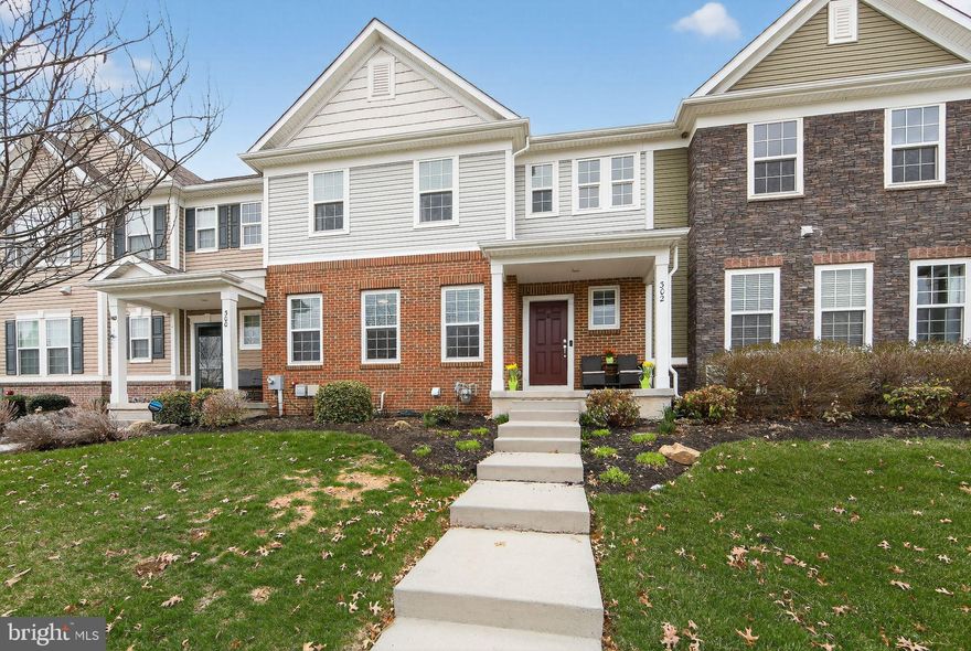 Welcome to 302 Stafford Court located in the vibrant community of The Courts At Chester Springs.  This gorgeous, impeccably maintained townhome features an open-concept layout and modern finishes that exude warmth, charm and grace. With four bedrooms, and four baths and over 3200 sq feet,  this home has two primary suite options, a dedicated first floor office with French doors, and a  fully finished basement with a full bath, offering lots of flexibility for living and entertaining.  This bright and sunny sanctuary is appointed with elegant dark wood flooring, oversized  windows with designer blinds, custom decorative shiplap walls, plush grade carpet, statement lighting, and sophisticated designer finishes and colors. A welcoming foyer sets the tone with a private office on the left complete with French Doors for privacy.   From the hall, the home flows seamlessly into the open family room, kitchen and dining room area.  The spacious kitchen is a chef’s dream featuring a large center island with a breakfast bar , white cabinets, a farmer’s sink, Stainless steel appliances, beautiful quartz countertops for both function and style, and a walk-in pantry with built-in new shelving.   Enjoy memorable family dinners in the elegant dining area with a custom wood accent wall , conveniently attached to the kitchen for effortless entertaining. Step out to the secluded back deck, perfect for watching sunsets and summer cookouts.  There is convenient first floor access to the spacious two car garage with a new storage rack.  The hall closet and first floor powder room complete the first floor.  Upstairs you will find the large primary suite wth en-suite bath complete with modern finishes and ample closet space.  A hallway leads to two bright and spacious bedrooms with ceiling fans with a shared luxurious hall bath. Each secondary bedroom provides comfort, natural light and large closets for ample storage.  A well appointed second floor laundry brings convenience and efficiency to everyday living! The expansive finished lower level offers a newly finished flex room that can be used as a media room, a gaming space, gym or playroom.  There is an additional large finished area with a brand new full bath and closet that provides the perfect option for a second owner’s suite, or a comfortable second family room retreat. It is the perfect place to enjoy endless hours of fun and entertainment with family and friends.  A generously sized storage room offers exceptional space for organization and storage needs.  This active community offers fantastic amenities, including a pool, pool house, tot lot, and a gathering area with a fire pit, and lots of walking trails. This home is ideally located within walking distance to the Weatherstone Town Center, with shops, restaurants, a convenience store, and the Henrietta Hankin Library, all contributing to the lifestyle you have envisioned.  This home is just minutes to all major commuting routes including Route 100, 401, Route 30 and the PA Turnpike, providing easy access to corporate business center, Marsh Creek State Park and Main Street in Exton filled with trendy dining and chic boutiques.  Schedule your showing today.  This special retreat is move in ready!