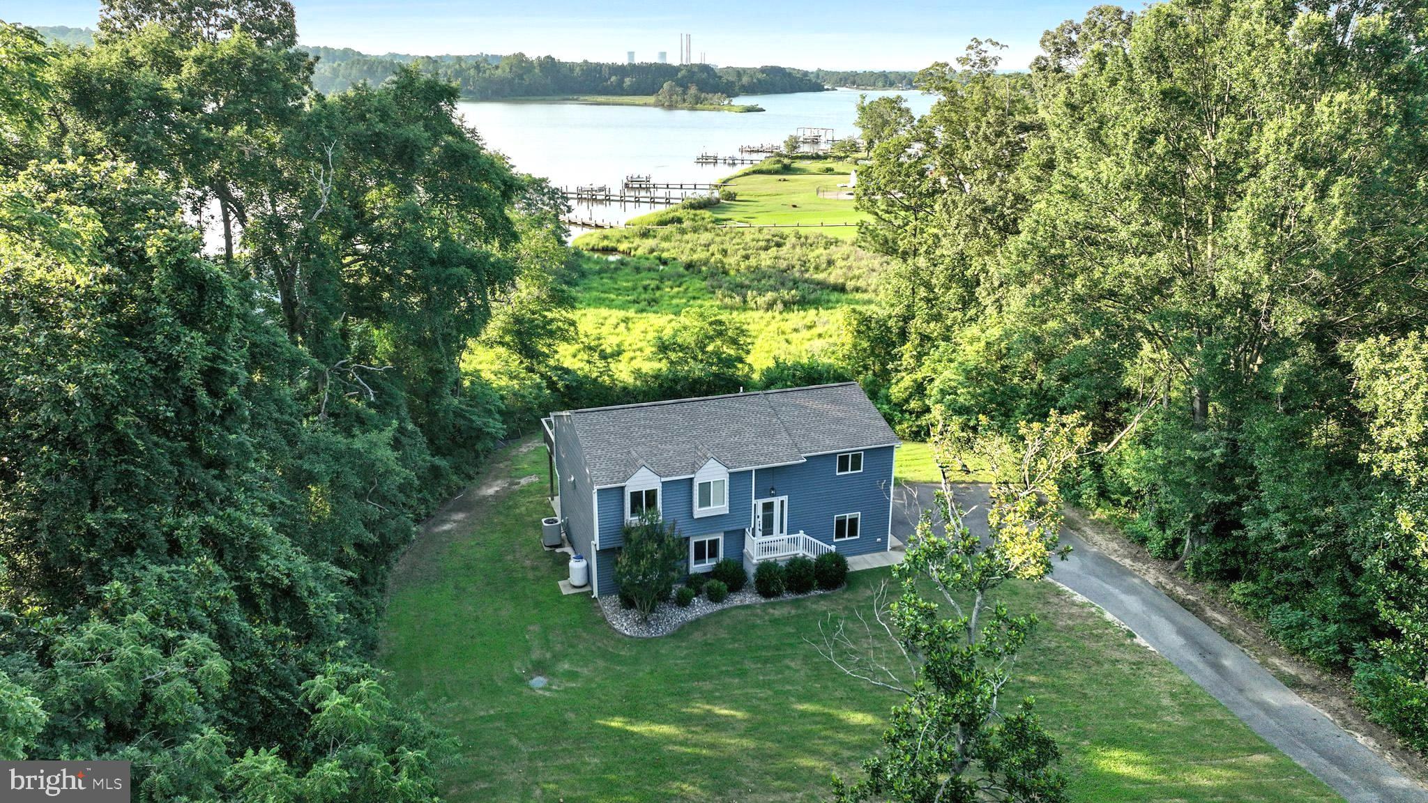 Enjoy Patuxent River views from this beautifully updated home, fully renovated in 2018 with a fresh, modern design. Nestled on a large, level lot, this property offers both luxury and functionality. Inside, you’ll find an open-concept layout with wood flooring, a bright and inviting family room featuring a three-sided fireplace, and a kitchen with stainless steel appliances, granite countertops, a spacious center island, and a large walk-in pantry. The owner's suite is a true retreat, complete with dual walk-in closets and a luxurious en-suite bathroom boasting a free-standing soaking tub, oversized walk-in shower, and double sink vanity. The lower level includes a spacious recreation room, two generously sized bedrooms, and a sleek full bathroom with a large, modern shower—perfect for guests or extended family. Step outside onto either of the two decks, one off the kitchen and one off the owner’s suite, and soak in tranquil river views—ideal for summer barbecues or morning coffee. The expansive, flat yard offers endless possibilities for outdoor living, and/or gardening. An extended driveway runs alongside the home, providing convenient space for your RV, camper, or boat. This property also provides ample space for your future detached garage. As a bonus, the property includes an additional .45-acre lot, offering even more privacy and potential with a total lot size of 1.19 acres. The Golden Beach community offers fishing piers, two play grounds, three private beaches, two boat ramps. and seasonal events that include a 4th of July parade and firework show, a Christmas tree lighting and an Easter egg hunt for all age groups.