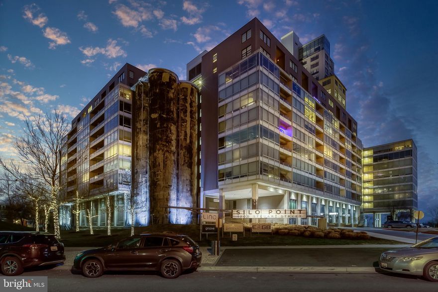 Incredible sunrise and direct water views from this unique sought-after Silo Point condo.  Located in Locust Point, Silo Point was constructed in 1923 and operated as the largest and fastest grain elevator in the world. Today it's an award winning 24-story modern condominium with bits of its history scattered throughout. This 1858 SQ FT, 2 bed 2.5 bath condo offers 9+' ceilings, floor to ceiling windows, wood floors, gourmet kitchen with new counters and black splash.  Enjoy amazing views from (almost) every room. Including the spacious primary bedroom with large walk-in closet, ensuite luxury bath and access to the balcony . This home comes with two parking spots conveniently located just down the hall in secure resident garage. Silo Point has a 24hr front desk, fitness center, game and conference rooms, pet areas, and a renovated 19th floor Sky Lounge. Easy access to downtown, 95, 295, 395, and 695. Short distance to Fort McHenry and the water taxi at Tide Point. This unit will not be on the market long!