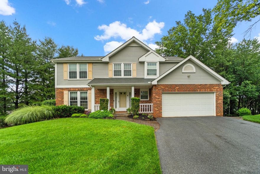 Beautifully updated and meticulously maintained, this spacious 5-bedroom, 3.5-bath home offers comfort and style in a serene cul-de-sac setting. The main level features gleaming hardwood floors, an updated kitchen with modern finishes including corian countertops and a duel fuel oven (gas stovetop and electric oven), and a cozy family room with a gas fireplace. Enjoy outdoor living on the screened-in deck overlooking a quiet, private backyard. The fully finished basement adds versatile living space, and the two-car garage provides convenience.