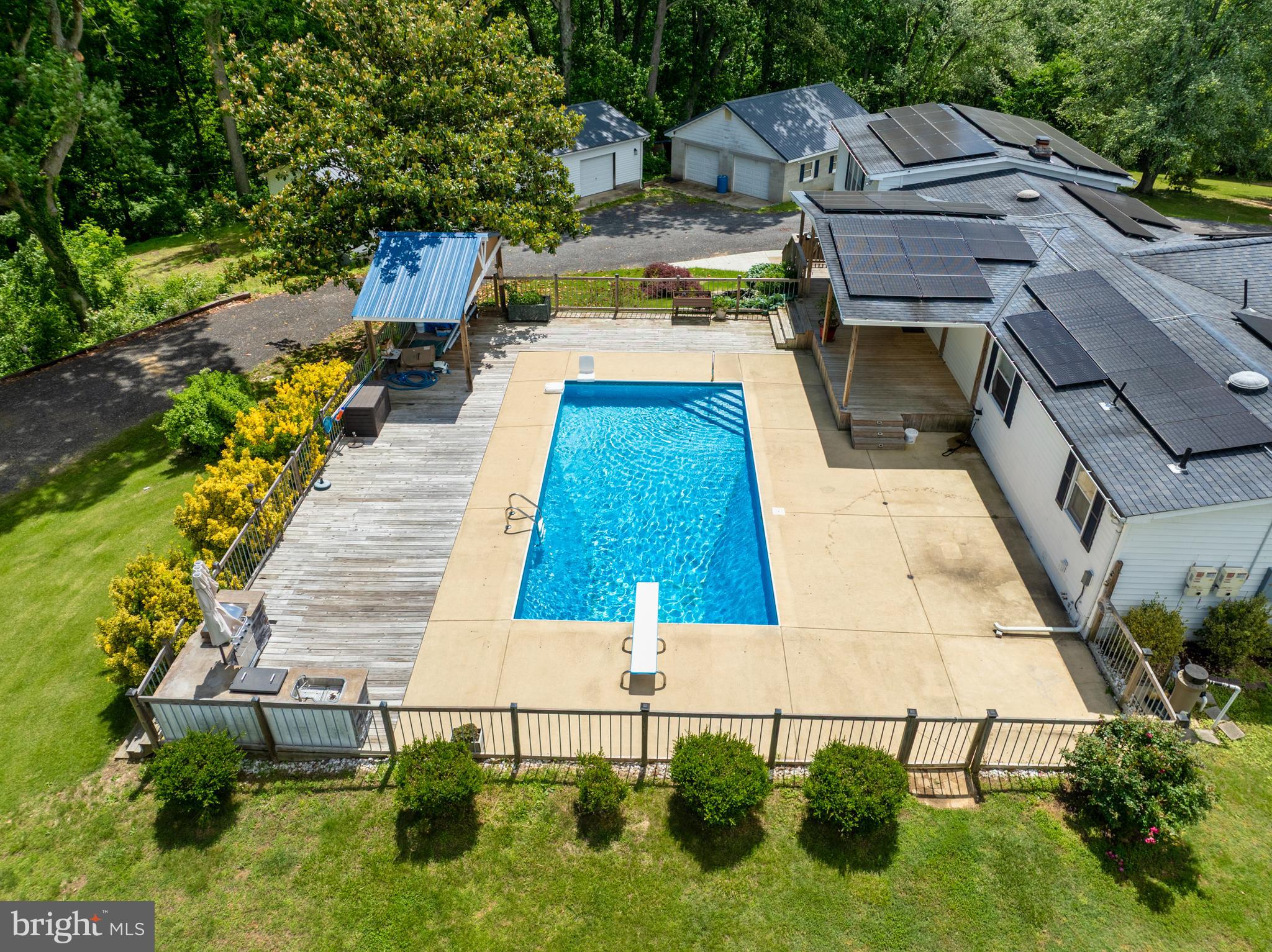Buyers financing fell through. Don't miss out of this one. Located on 3 1/2 acres, pool and 6 Car Garage! Easy Commute to the DMV Area right off Route 4. Welcome to this great home perfect for entertaining and offers a variety of spaces to suit every lifestyle. The gourmet kitchen comes fully equipped with all appliances. The spacious living room with built in benches makes it a cozy sitting area feature a built-in wine cooler, perfect for relaxing or hosting guests. The primary bedroom is conveniently located on the main level and boasts a luxurious primary bathroom and a large walk-in closet with custom built-ins. This space has the potential to be converted into another bedroom if needed. Step outside to your private oasis with a back deck leading to an in-ground pool, an outdoor kitchen with a grill, and plenty of room for entertaining or enjoying the beautiful outdoors. Adjacent to the kitchen, you'll find a second primary bedroom with a fireplace – perfect as a guest suite, or for use as a family room or quiet retreat. The lower level offers a third bedroom, a large recreation room, and an additional room that could be perfect as an office or workout area – the possibilities are endless. With two separate garages offering six parking spaces and additional parking space for guests, this home ensures convenience and comfort. A charming garden koi pond adds to the peaceful ambiance of the front yard. Located just an easy commute route 4 to Washington DC, this home offers the perfect balance of peaceful living and accessibility to the city. Roof 2009. Don’t miss out on this incredible opportunity! The seller is offering a 1 year HMS home warranty.
