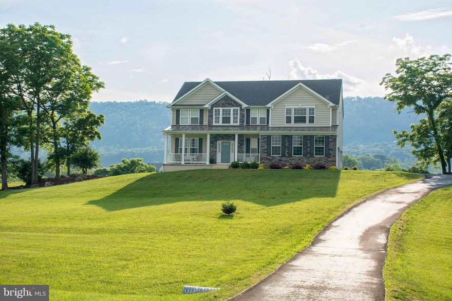 OMG! what a gorgeous home with gorgeous views of the surrounding farmland and vistas. This one has all the upgrades inside. Beautiful wood floors, upgraded 42" kitchen cabinets, granite, front porch, rear deck, acreage, side load garage, full basement for added growth, paved drive. Take a look and say "Honey, stop the car, we're home"