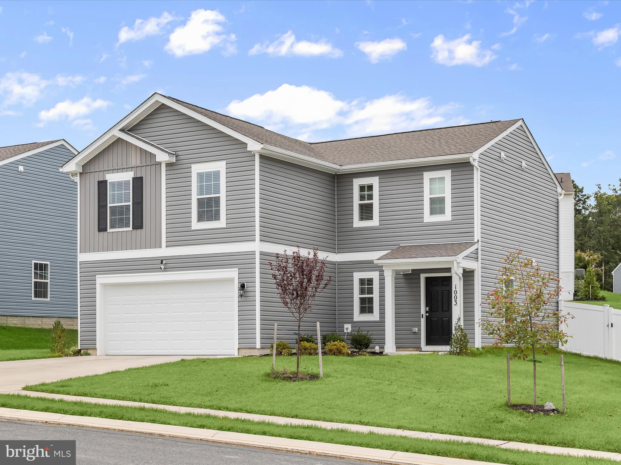 Offering four bedrooms and two and a half bathrooms, this 2024 built D.R. Horton home is located in Ridgely’s Reserve, Joppa’s premier new community. The open-concept main level features luxury vinyl plank flooring and a living room with custom lighted built-ins and a gas fireplace. The dining area opens through sliding glass doors to the fenced backyard, while the kitchen is highlighted by granite countertops, a subway tile backsplash, upgraded appliances, an island with seating, and a pantry. Finishing the main level is a half bathroom and access to the two car garage. Upstairs, the primary bedroom boasts a walk-in closet and private bathroom with a dual vanity and walk-in shower. Three additional bedrooms, a second full bathroom with a tub-shower, and a laundry room complete the upper level. Outside, the large fenced backyard offers plenty of space for everyone’s activities. Community amenities include a playground, open green spaces, walking trails, and a ball field. Conveniently located in Harford County’s I-95 corridor, the home is just minutes from downtown Bel Air for shopping and dining, one exit from White Marsh, and an easy commute to Baltimore.